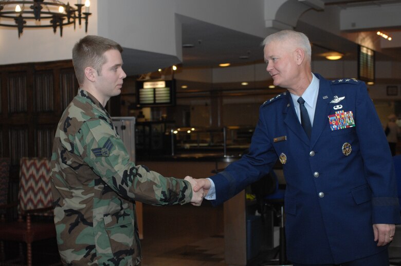 Lt. Gen. Rod Bishop, 3rd Air Force commander, (right) thanks an Airman for his contributions to the Global War on Terrorism following a breakfast with Airmen at the dining facility here Nov. 7. (U.S. Air Force photo by Airman 1st Class Brad Smith) 