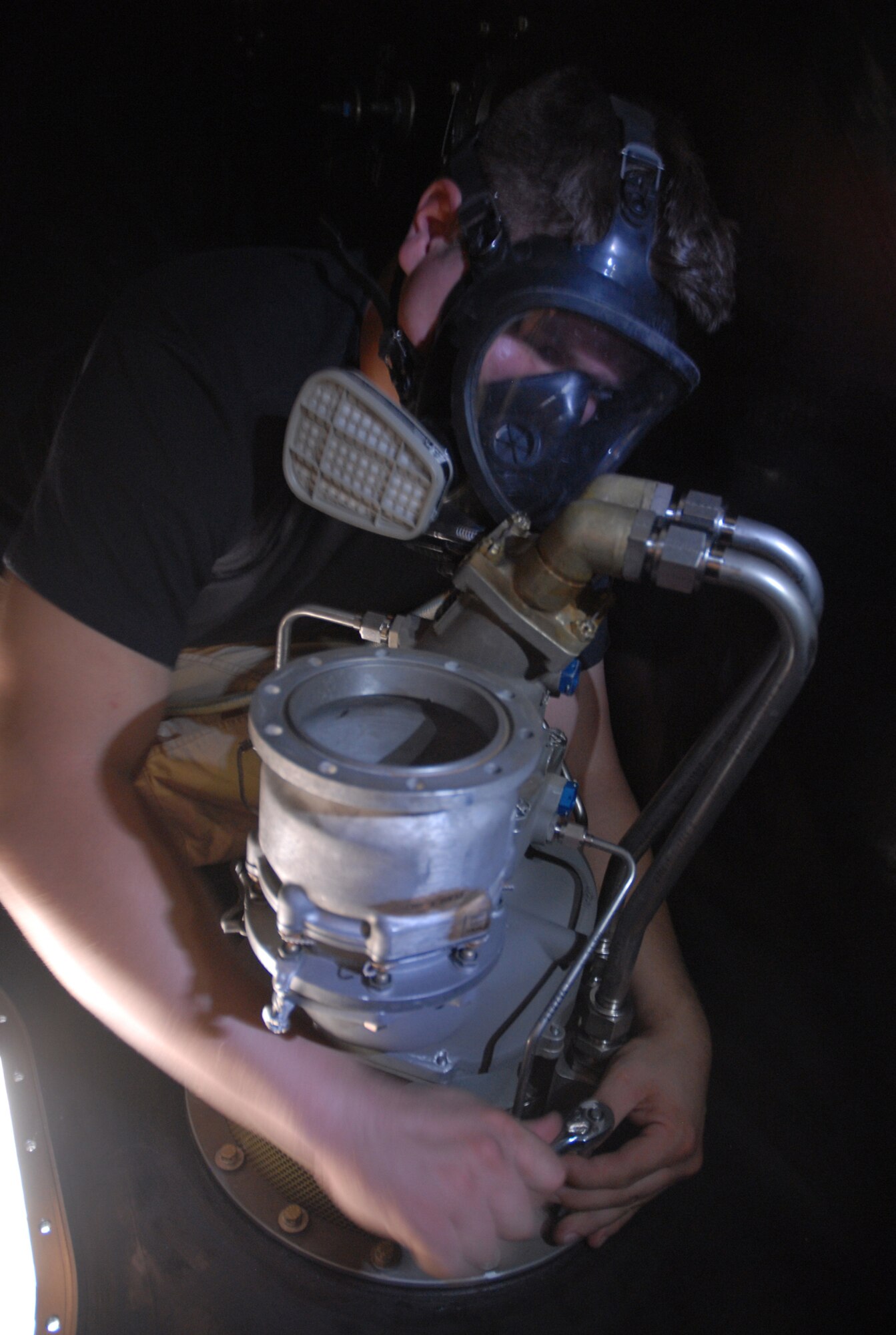 SOUTHWEST ASIA - Airman 1st Class Shaun Carrig, 379th Expeditionary Aircraft Maintenance Squadron fuel systems journeyman, installs a for and aft air refueling pump in the #3 forward body fuel tank of a KC-135 Stratotanker Nov. 17 at a Southwest Asia air base. Airman Carrig is deployed from Grand Forks AFB, N.D., and his hometown is Cleveland, Ohio.(U. S. Air Force photo/Staff Sgt. Douglas Olsen)