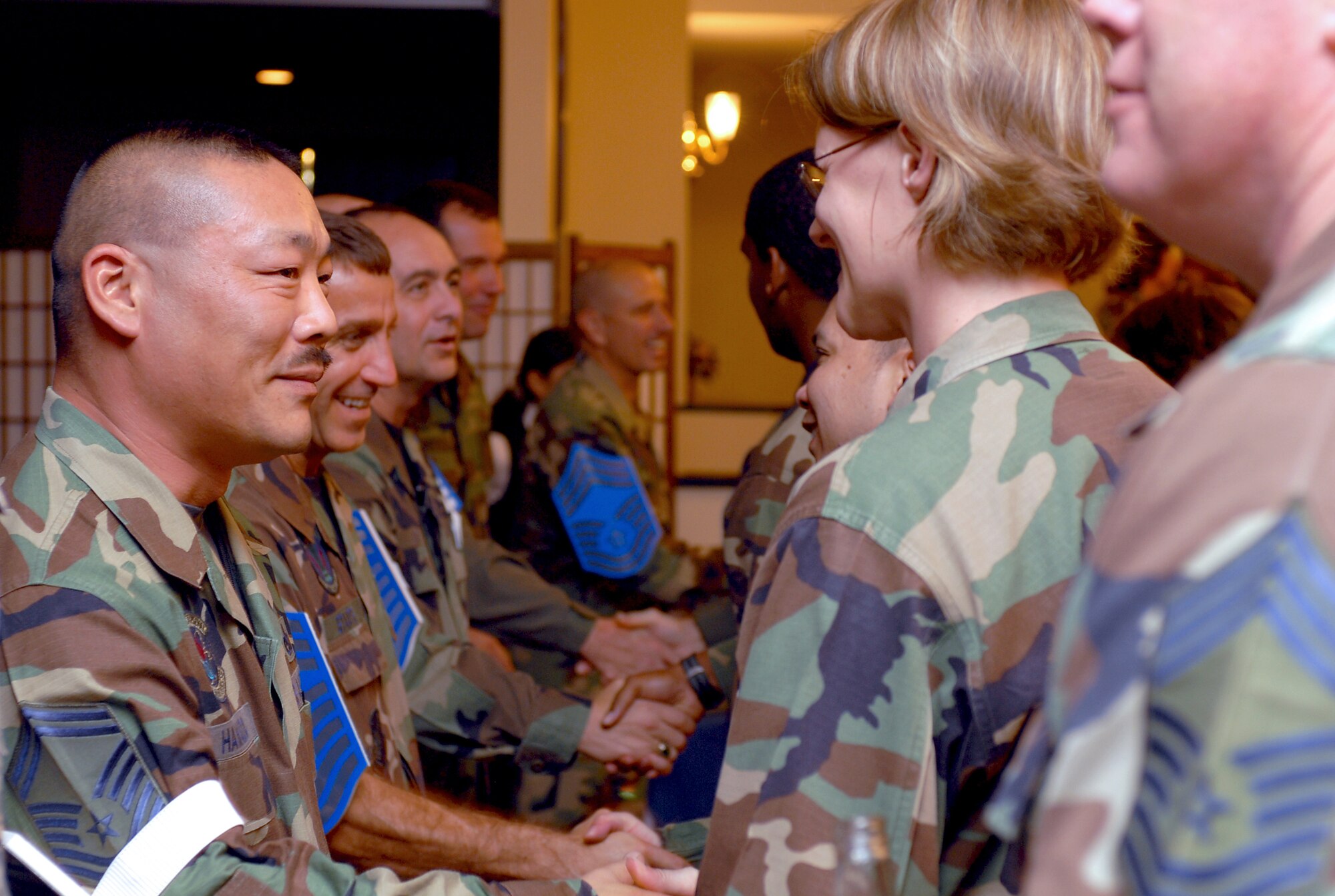 Members of Kadena Air Base, Japan, congratulate chief master sergeant selects during the Chief Icebreaker Ceremony, Nov. 16, 2007.  The ceremony was held to congratulate 10 chief master sergeant selects here for making it into one of the most elite groups in the world.  By law only the top one percent of the enlisted corps is promoted to chief master sergeant.  (U.S. Air Force photo/Airman 1st Class Kelly Timney)