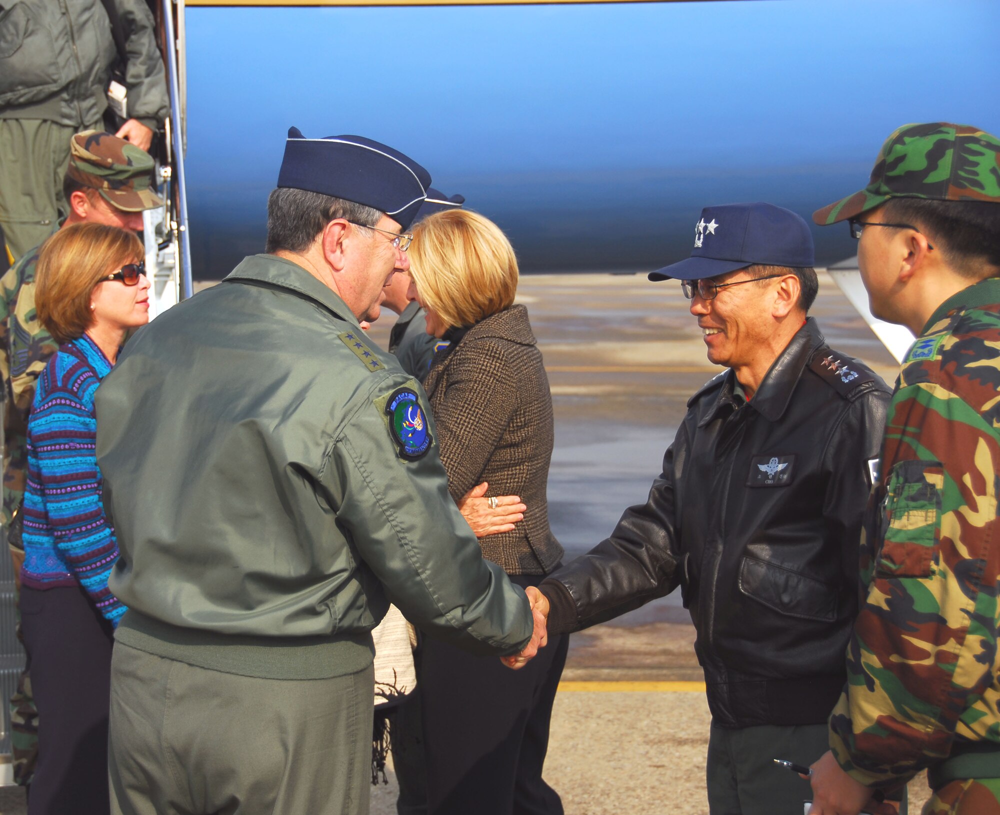 OSAN AIR BASE, Republic of Korea -- Gen. Paul V. Hester, commander of Pacific Air Forces, greets Lt. Gen. Won Kun Cho, commander of Air Force Operations Command, Republic of Korea, after arriving here Nov. 21. (U.S. Air Force photo by Staff Sgt Ronnie Hill) 