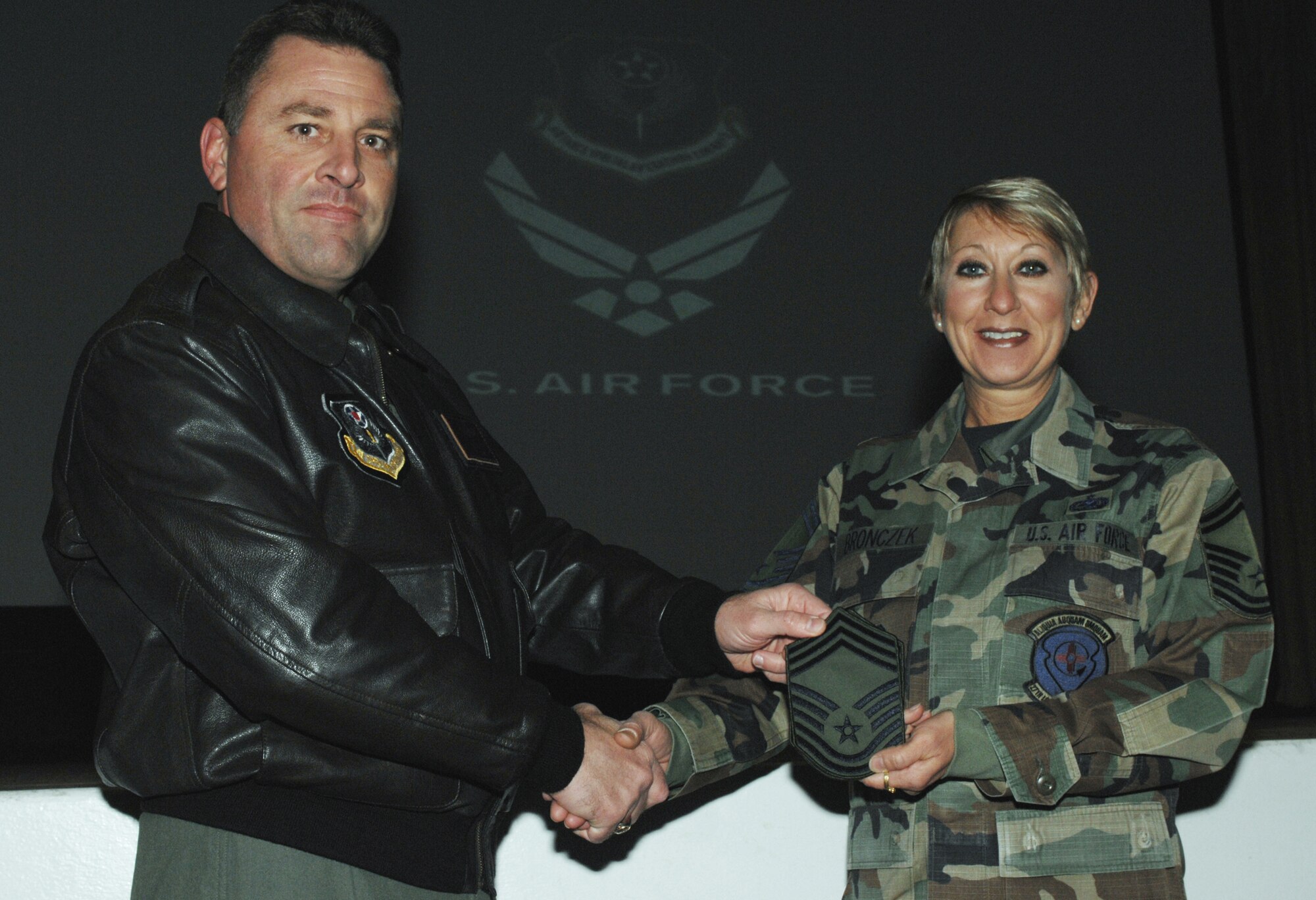 CANNON AIR FORCE BASE, N.M.--Col. Timothy Leahy, 27th Special Operations Wing commander, congratulates Senior Master Sgt. Sandra Bronczek, 27th Special Operations Logistics Readiness Squadron, on her selection for promotion to Chief Master Sgt. on Nov. 13. (Air Force photo by Staff Sgt. Richard Williams)