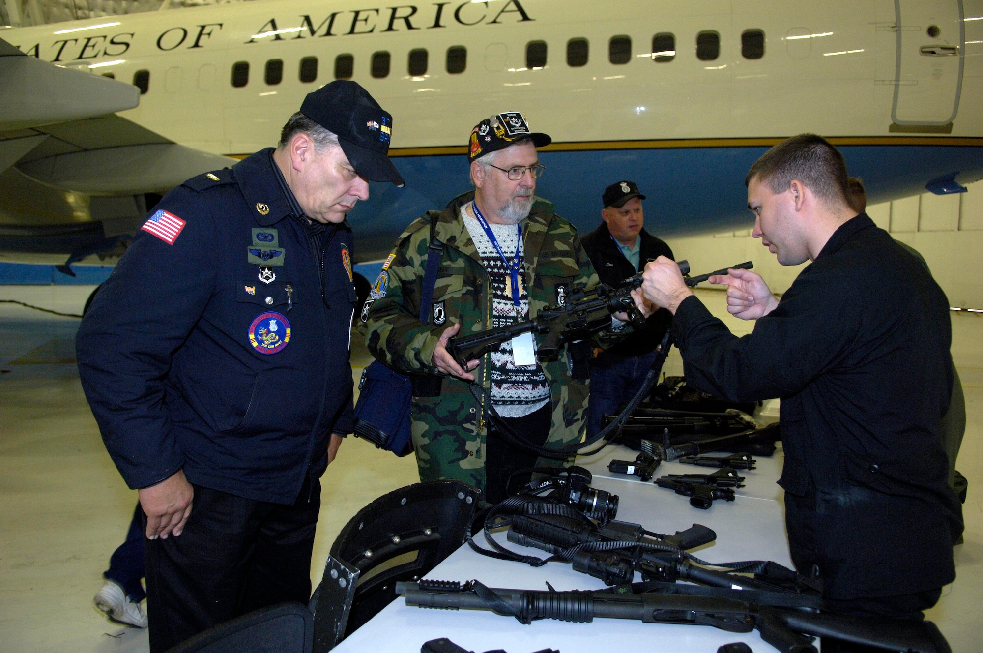 Staff Sgt. David N. Wood, 316th Security Forces Emergency Service Team, demonstrates asp techniques during the Vietnam Veterans visit on Nov. 9. Hangar three events included lunch, static displays, canine tactics demo, a vehicle assault and officer recovery scenario, and Raven capabilites demonstration.(US Air Force/A1C Renae Kleckner)