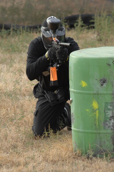 Staff Sergeant Christopher Hobbs fires away at his competition Nov. 17 during the 4th Annual Dyess Olympics. His team, Delta Farce, placed first during the paintball competition. (U.S. Air Force photo by Airman Stephen Reyes)
