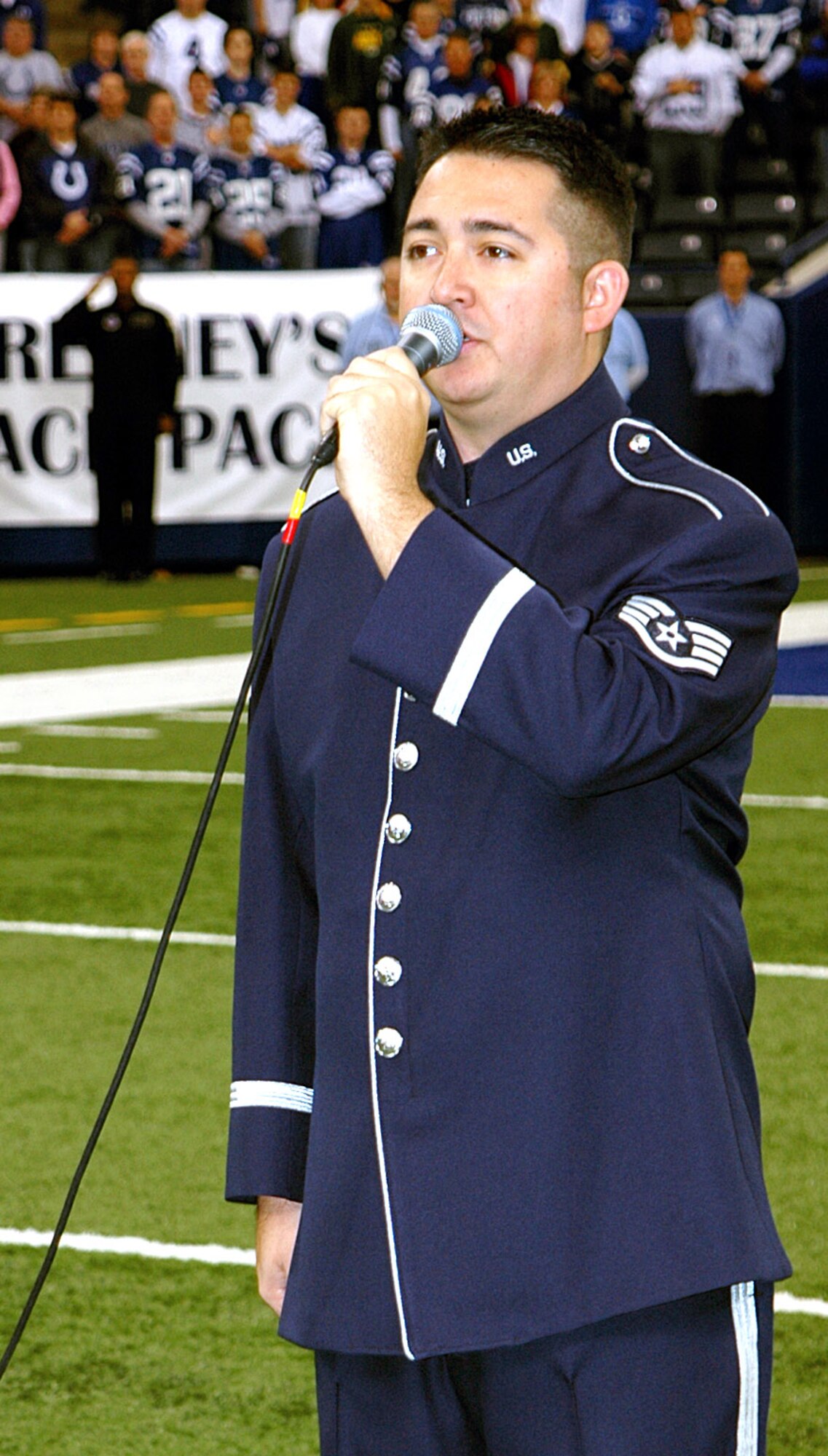 Staff Sgt. Justin Allen sings the national anthem before the Indianapolis Colts vs. Kansas City Chiefs National Football game Nov. 18 in Indianapolis. The Colts received the prestigious American Spirit Award before the start of the game. Sergeant Allen is a member of the Air Force Band of Flight. (U.S. Air Force photo/Senior Airman Carl Berry) 