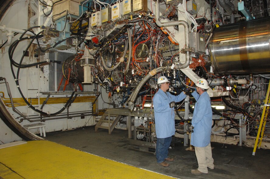 From left, Russell Montandon, Aerospace Testing Alliance (ATA) outside machinist and ATA Boilermaker Nathan Tippy, inspect the GE/Rolls-Royce F136 engine in Arnold Engineering Development Center’s (AEDC) Test Cell J-2 during a break in testing. (Photo by David Housch)