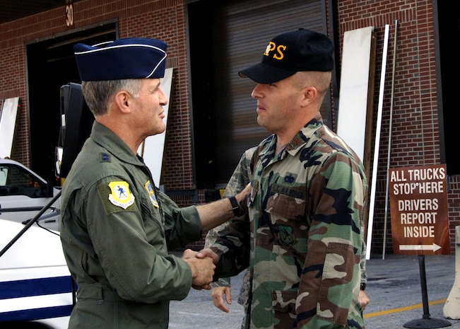 Major Chad Morris, 437th Aerial Port Squadron acting commander greets Maj. Gen. James Hawkins outside of the APS warehouse Nov. 14 during his visit to Charleston AFB. (U.S. Air Force photo/Airman 1st Class Katie L. Gieratz)