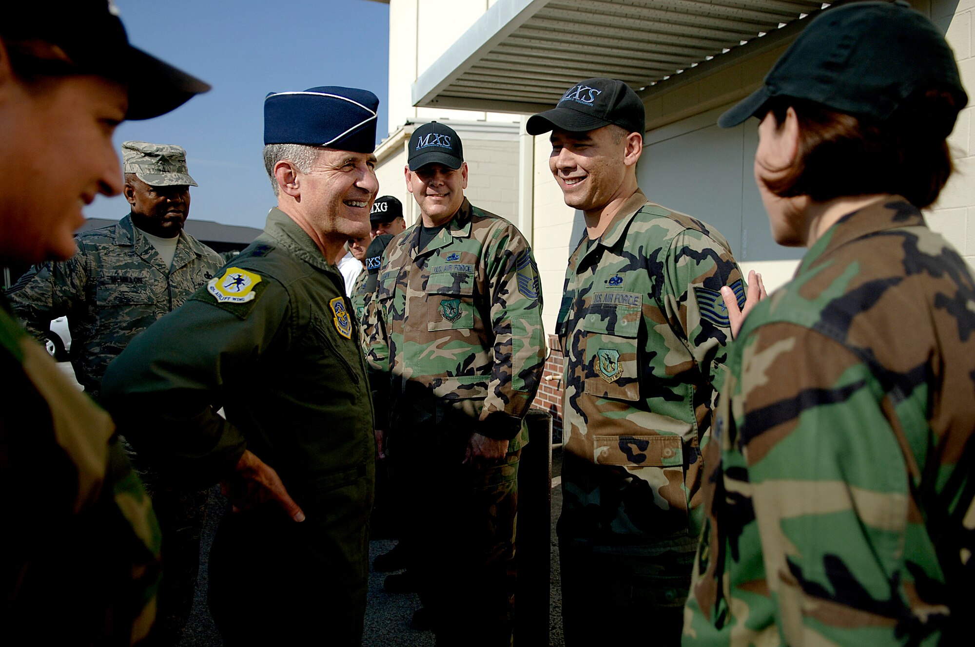 Maj. Gen. James Hawkins, 18th Air Force commander, talks with Airmen from the 437th Maintenance Squadron Nov. 14 outside of the Home Station Check hangar.(U.S. Air Force photo/Senior Airman Nicholas Pilch)
