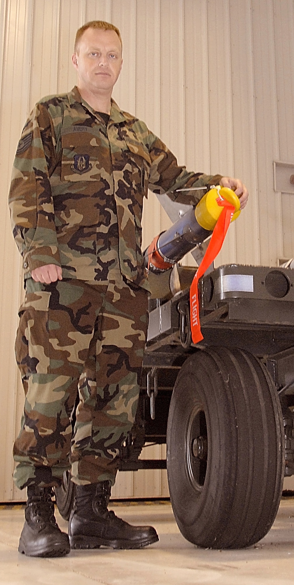 Tech. Sgt., now Doctor, Scott Avery from the 442nd Aircraft Maintenance Squadron, stands with an AIM-9 air-to-air missile.  Sergeant Avery graduated from medical school in September and is also an Air Force Reservist who loads ordnance on A-10 Thunderbolt II aircraft for the 442nd Fighter Wing, based at Whiteman Air Force Base, Mo.  (U.S. Air Force photo/Master Sgt. Bill Huntington)