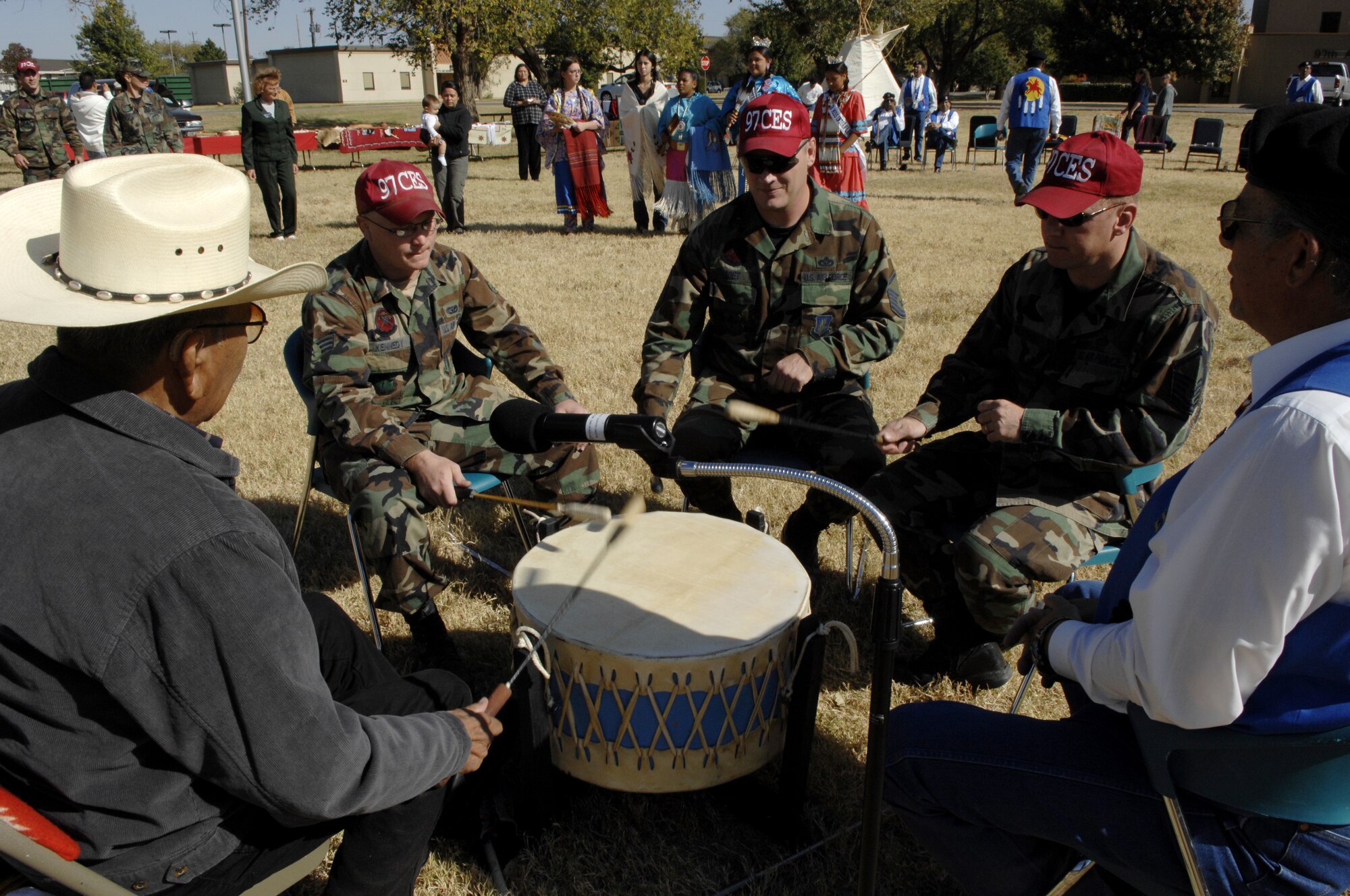 Altus Air Force Base, Okla -- Airmen from the 97th Civil Engineering Squardon interact with Comanche Nation tribesmen during the American Indian and Alaskan Native Heritage Celebration Pow Wow Nov. 7 at the parade field on base. (U.S. Air Force by Senior Airman Joshua DeMotts)