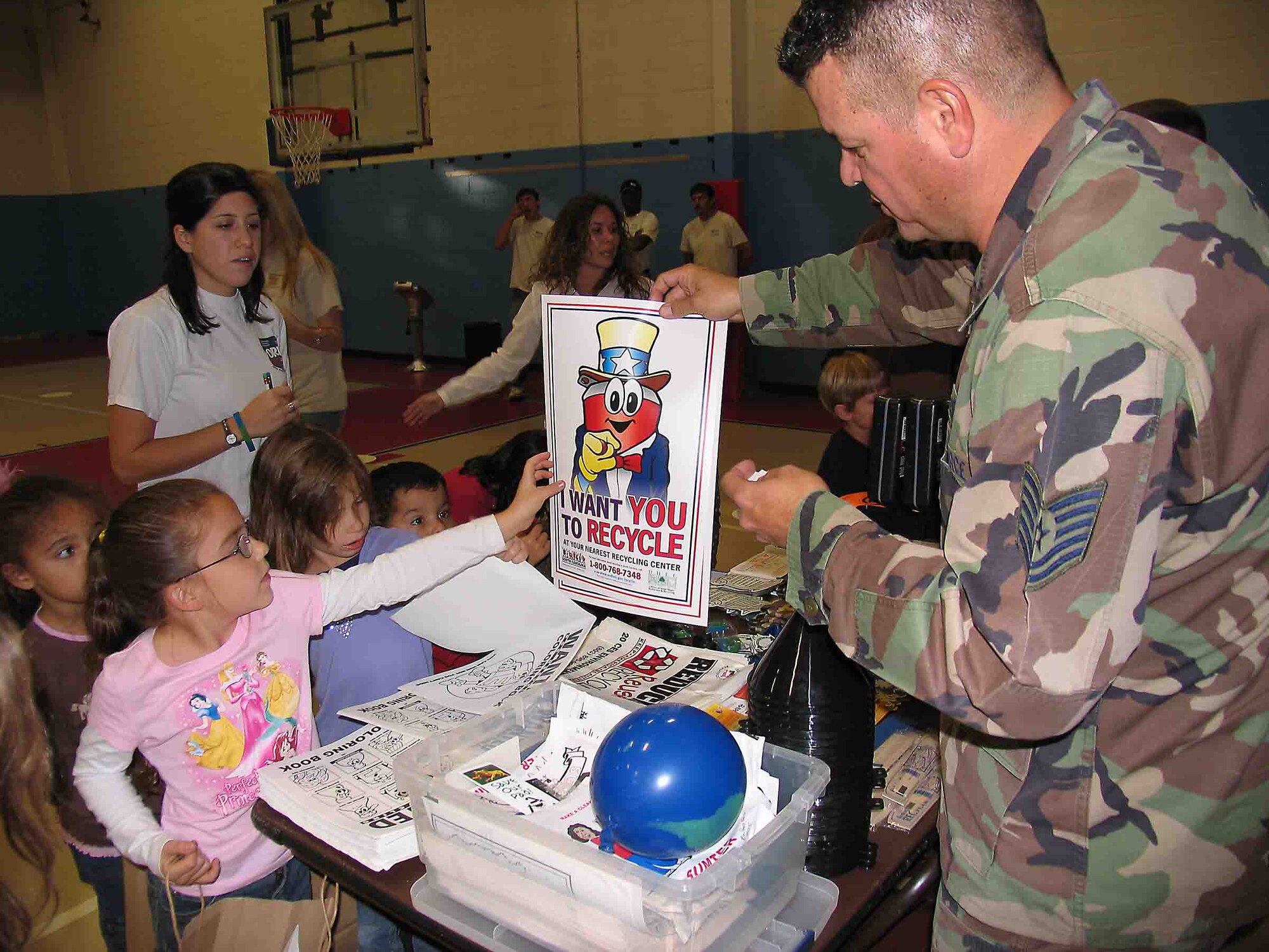 SHAW AIR FORCE BASE, S.C. -- Tech. Sgt. Andrew Teague, 20th Civil Engineer Squadron installation solid waste manager, energizes the children and proclaims "I want YOU to recycle" Nov. 15 during America Recycles Day. Sergeant Teague is  the recycling liaison between the base and Sumter County and city programs. ARD is the only nationally recognized day dedicated to encouraging Americans to recycle and to buy recycled products. (Courtesy photo)
