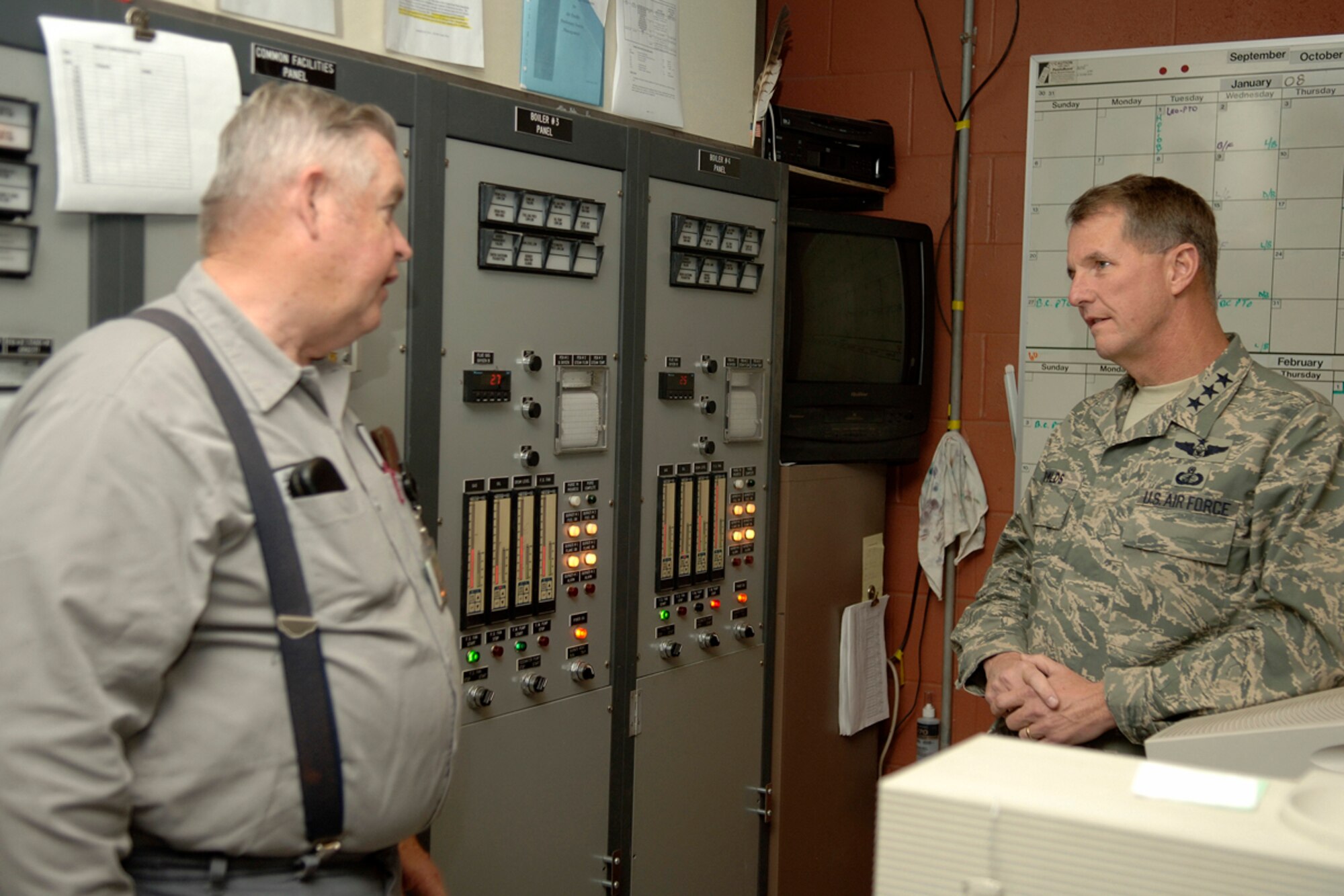 HANSCOM AIR FORCE BASE, Mass. -- Larry Morton Jr., Base Steam Plant supervisor, explains the inner workings of the plant to Electronic Systems Center Commander Lt. Gen. Ted Bowlds a tour of the plant Nov. 16 during the general’s tour of Hanscom. (U.S. Air Force photo by Jan Abate)