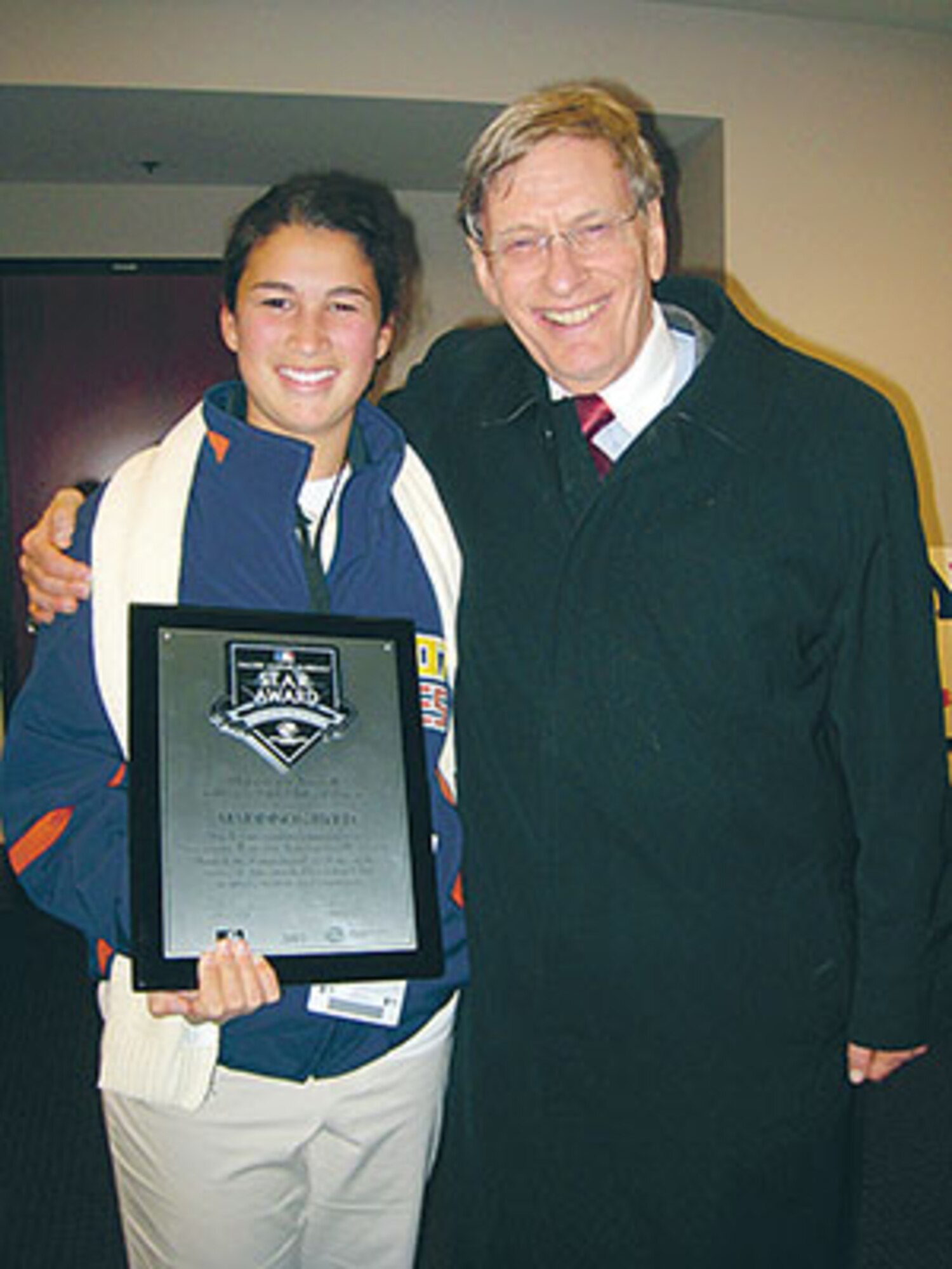 Baseball Commissioner Bud Selig with Ramstein?s Maddie Byrd at game three of the World Series. Maddie was named the Major League Baseballl STAR of the year.
