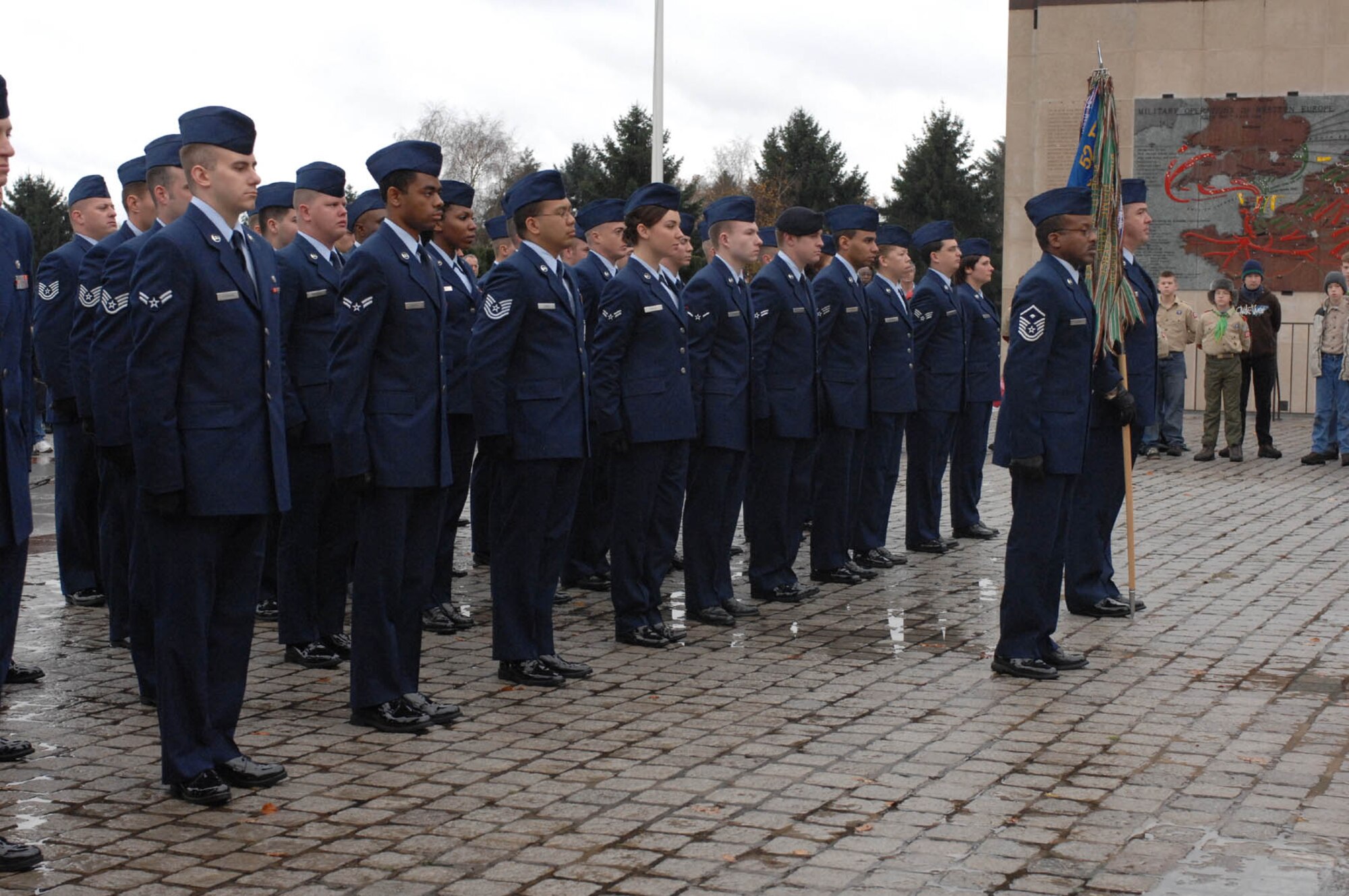 SPANGDAHLEM AIR BASE, Germany -- Airmen from the 52nd Fighter Wing stand at attention during a Veterans Day Wreath Laying Ceremony held at Luxembourg American Cemetery and Memorial Nov. 11. The Airmen had come to honor those who had served before them.  (U.S. Air Force photo/Airman 1st Class Jenifer Calhoun)