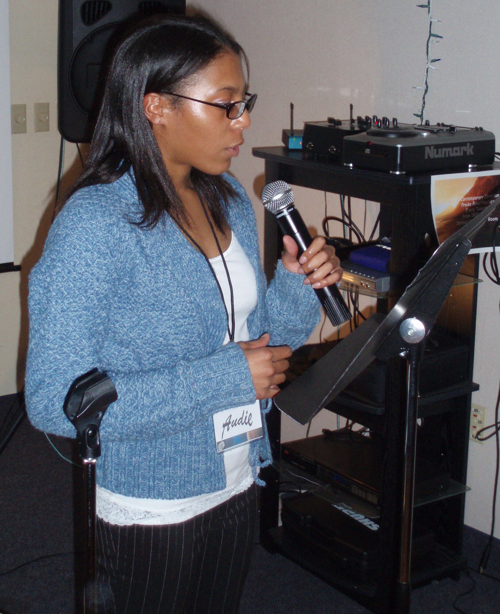 Airman 1st Class Audrey Hopgood, 341st Maintenance Operations Squadron visual imagery and intrusion detection systems technician, recites lyrical poetry during the first Open Mic Poetry Night at the Detour Nov. 8. The event was started by Airman Hopgood and Airman 1st Class Oren Walker, 341st Medical Operations Squadron health services manager. Twenty-five people attended and 10 Airmen read at least three poems each which varied in style and structure. The next Open Mic Poetry Night is scheduled at the Detour Dec. 6 at 7:30 p.m. (U.S. Air Force photo/Airman 1st Class Oren Walker)