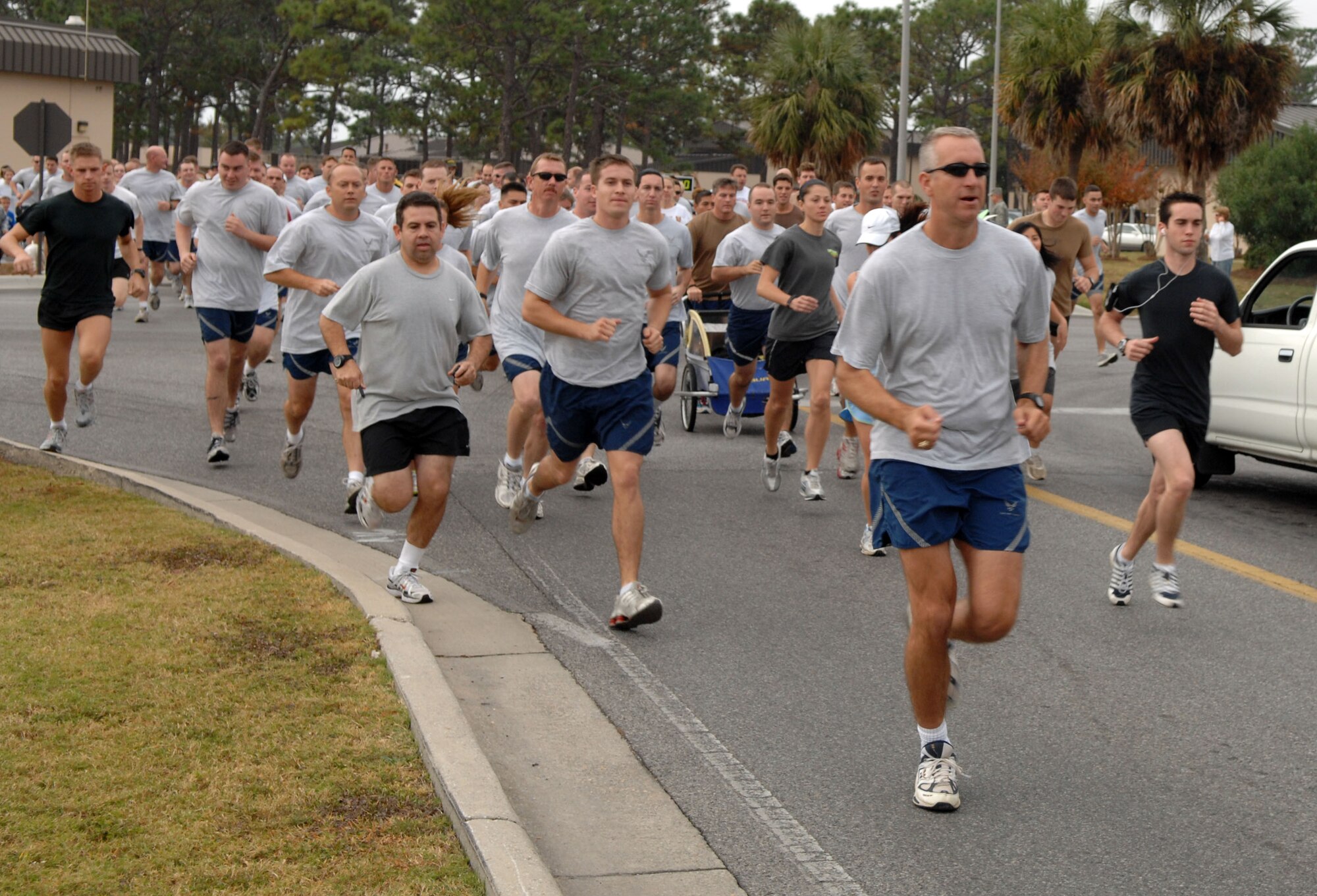 Runners at the 27th annual Hurlburt Field Turkey Trot break from the starting line Nov. 21. Runners and walkers of all ages, and some youngsters on bicycles, took to the streets on a pre-holiday five-kilometer run.