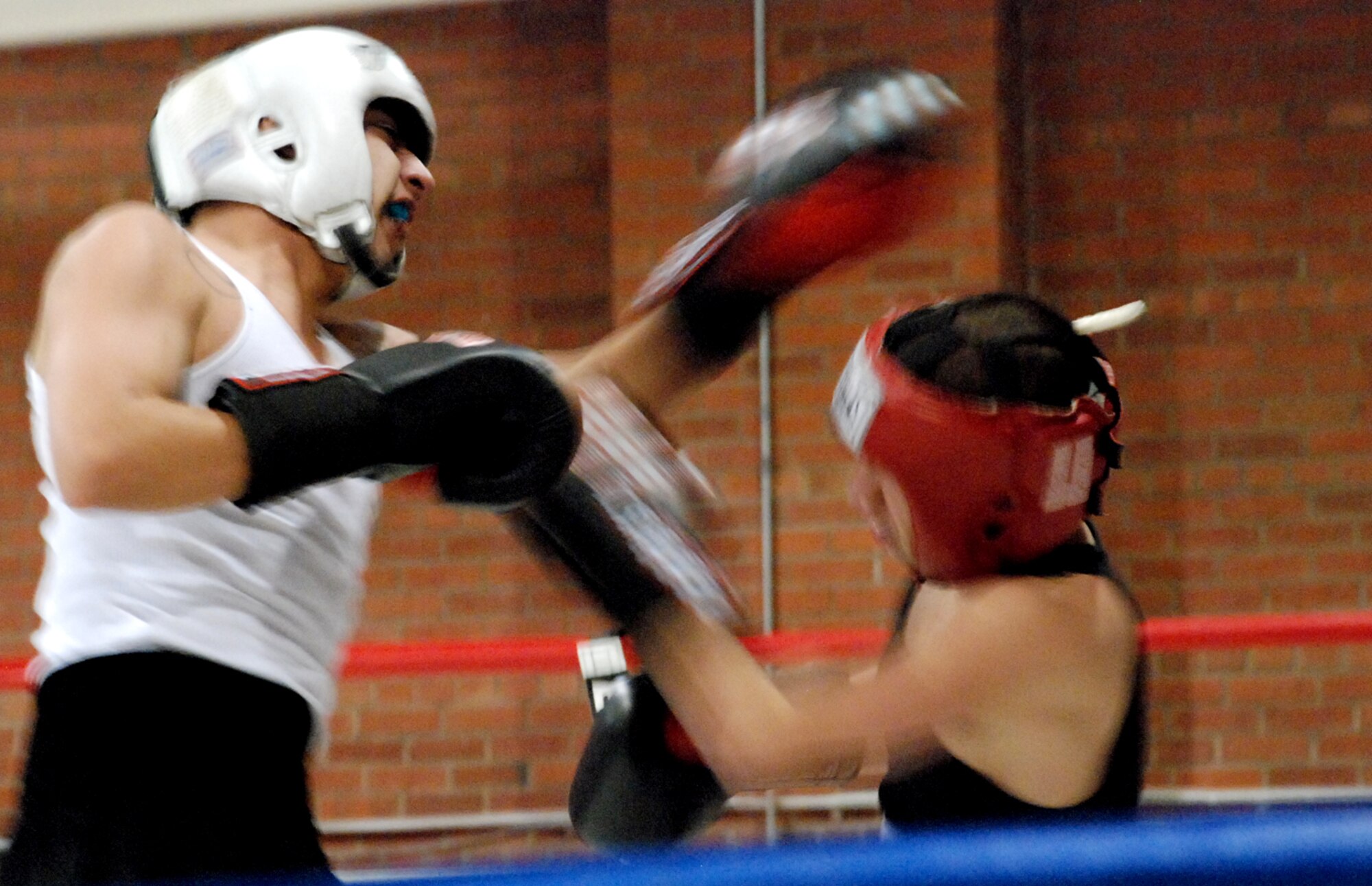 Gabriel Vincent and his brother Montoya, Cheyenne Boxing Club, pummel each other during the exhibition match.