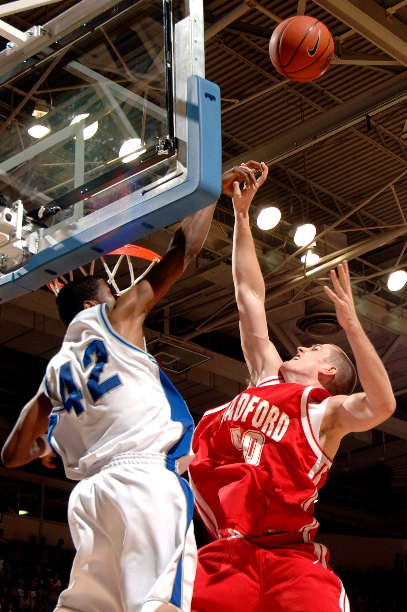 Junior guard Andrew Henke blocks a shot as the Air Force Falcons defeated the Radford Highlanders 52-47 in overtime Nov. 19 at Clune Arena.  Air Force, under first-year coach Jeff Reynolds, is 4-0 on the season.  (U.S. Air Force photo/Mike Kaplan)