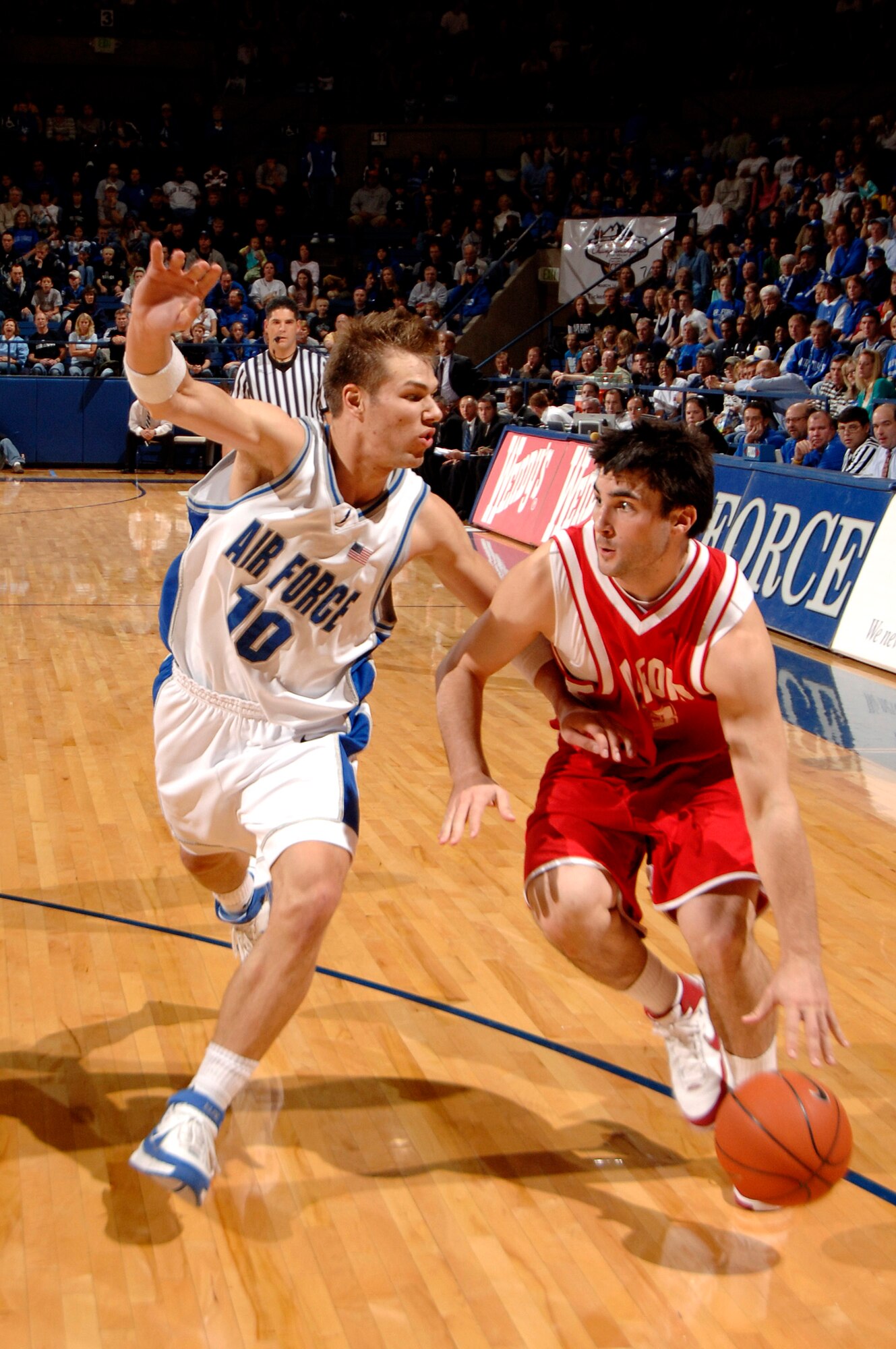 Junior guard Andrew Henke applies defensive pressure as the Air Force Falcons defeated the Radford Highlanders 52-47 in overtime Nov. 19 at Clune Arena.  Air Force, under first-year coach Jeff Reynolds, is 4-0 on the season.  (U.S. Air Force photo/Mike Kaplan)