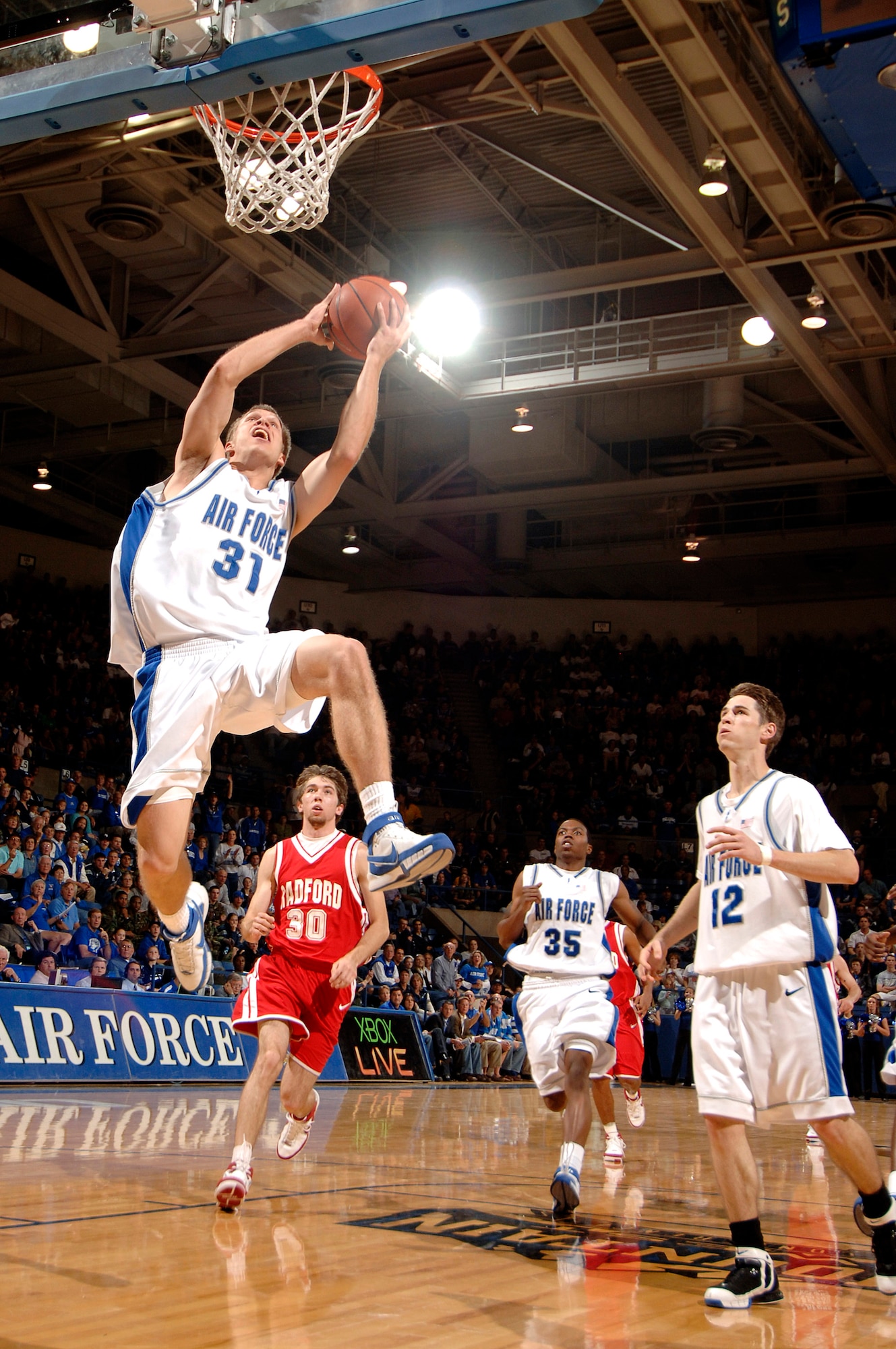 Junior forward Matt Holland pulls down a rebound as the Air Force Falcons defeated the Radford Highlanders 52-47 in overtime Nov. 19 at Clune Arena.  Air Force, under first-year coach Jeff Reynolds, is 4-0 on the season.  (U.S. Air Force photo/Mike Kaplan)