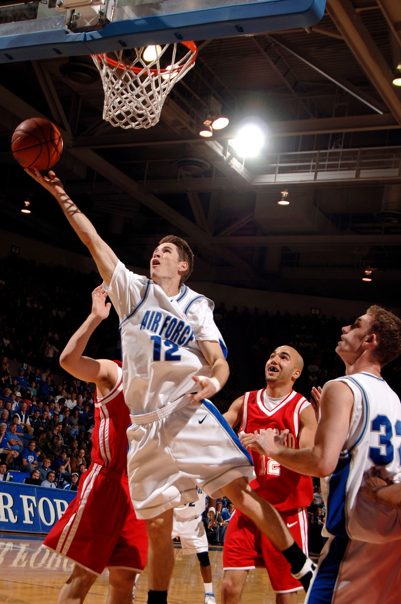 Senior guard Tim Anderson pulls down a rebound as the Air Force Falcons defeated the Radford Highlanders 52-47 in overtime Nov. 19 at Clune Arena.  Air Force, under first-year coach Jeff Reynolds, is 4-0 on the season.  (U.S. Air Force photo/Mike Kaplan)