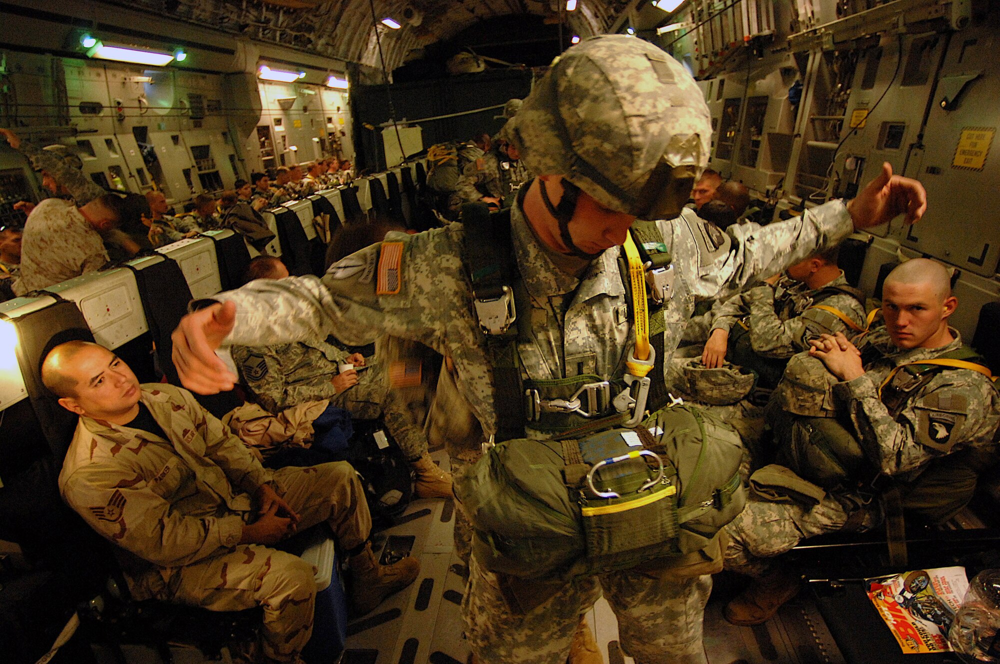 U.S. Army paratroopers from the 20th Engineering Brigade, 101st Airborne Division, Fort Campbell, Ky., and Egyptian paratroopers prepare their chutes aboard a Charleston Air Force Base, S.C., C-17 Globemaster III aircraft for an air drop into Cairo, Egypt, Nov. 7 as part of exercise Bright Star 2007. (U.S Air Force photo/Staff Sgt. Aaron Allmon)