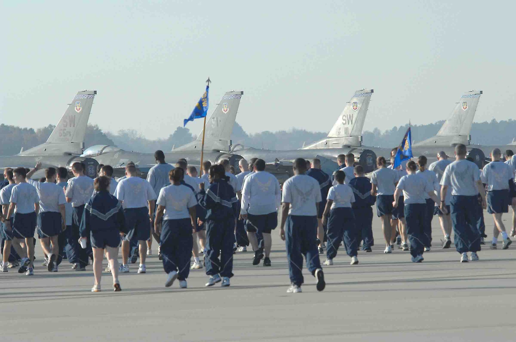 SHAW AIR FORCE BASE, S.C. -- Members of the 20th Fighter wing look for foreign object debris after the conclusion of a the Valor Run Nov. 21. A FOD walk removes any debris and trash from the flightline because it may cause damage to aircraft. (U.S. Air Force Photo/Staff Sgt. Henry L. Hoegen Jr.)

