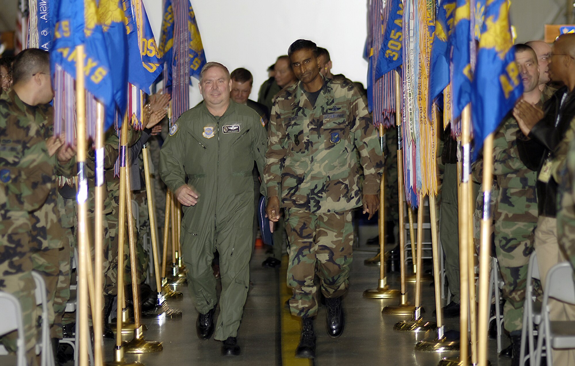 Col. Balan Ayyar, 305th Air Mobility Wing commander, leads Col. Stan Dougherty, Air Mobility Command Unit Compliance Inspection Team chief, to a McGuire C-17 waiting to take the UCI team back to Scott AFB. The UCI team spent the last week evaluating the wing's processes. McGuire received an excellent rating for the UCI. (U.S. Air Force photo / Kenn Mann.)