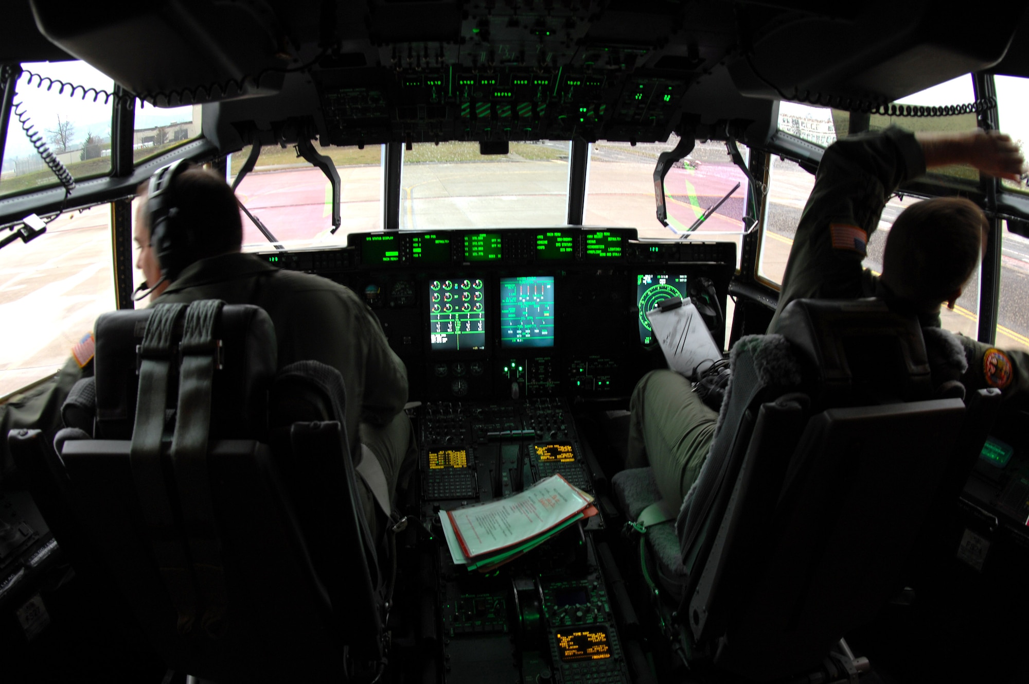 Lt. Col. Todd Oliver (left) and his wingman prepare for take off in the new C-130J Hercules aircraft Nov. 8 at Ramstein Air Base, Germany. Starting 2009-2011 the C-130J will began to replace the aging C-130Es at Ramstein aB. (U.S. Air Force photo/Airman 1st Class Kenny Holston) 






