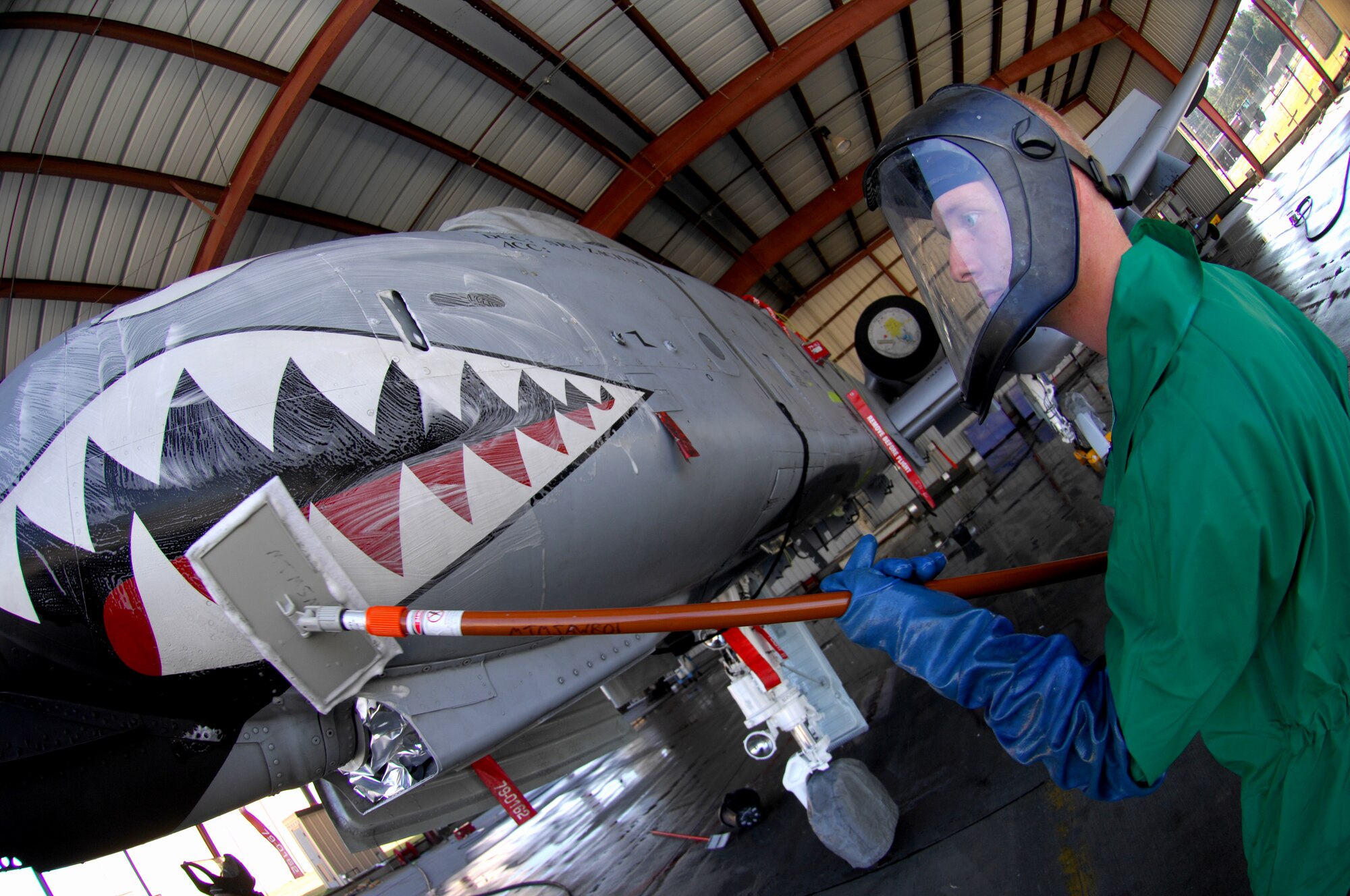 Airman 1st Class Joshua Norris, 23rd Aircraft Maintenance Squadron A-10C Thunderbolt II crew chief, washes his aircraft Nov.19 at moody’s corrosion control wash rack.  The A-10C Thunderbolt receives a thorough wash-down and lubrication every three months to prevent corrosion and inspect for surface damage.  (U.S. Air Force photo by Senior Airman Angelita Lawrence)
