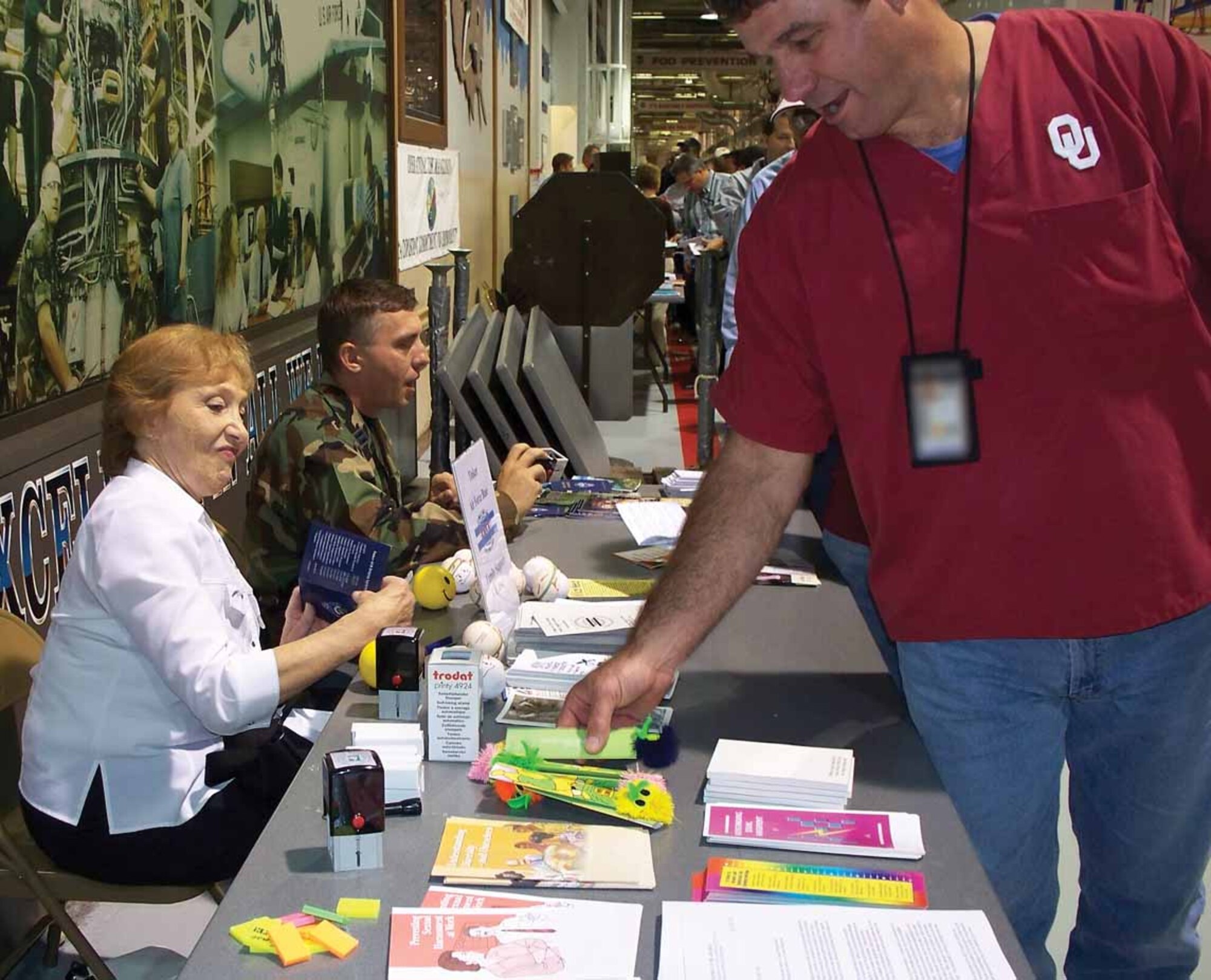Chaplain (Capt.) Piotr Gajda from the Tinker Chapel and Julia Gant from the Tinker Family Support Center discuss classes and programs available to all Tinker employees this past Wingman Day. (Courtesy photo)