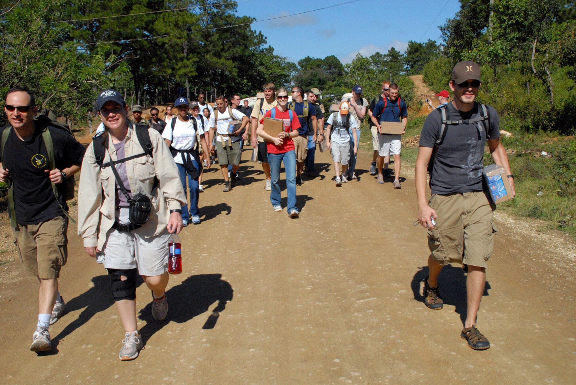 A group of approximately 70 servicemembers from Joint Task Force-Bravo at Soto Cano Air Base, Honduras, begin an 11-mile round trip hike up a mountain to deliver more than 600 pounds of food to local villagers Nov. 17. The hike allowed servicemembers to celebrate Thanksgiving with those less fortunate. (U.S. Air Force photo/Tech. Sgt. Sonny Cohrs) 