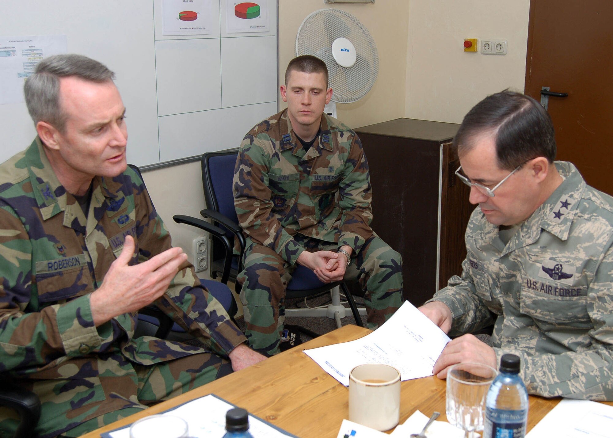 SPANGDHALEM AIR BASE, Germany -- Capt. Cory Baker, 52nd Medical Support Squadron, sits in on a meeting between Maj. Gen. Marc Rogers, U.S. Air Forces in Europe vice commander, and Col. Darryl Roberson, 52nd Fighter Wing commander, as part of the Commanders Shadow program. Captain Baker the Medical Logistics Flight commander is a native of Marshfield, Mo. He spent the day shadowing the commander to learn about base operations. (U.S. Air Force photo/Staff Sgt. Chris Mills)

