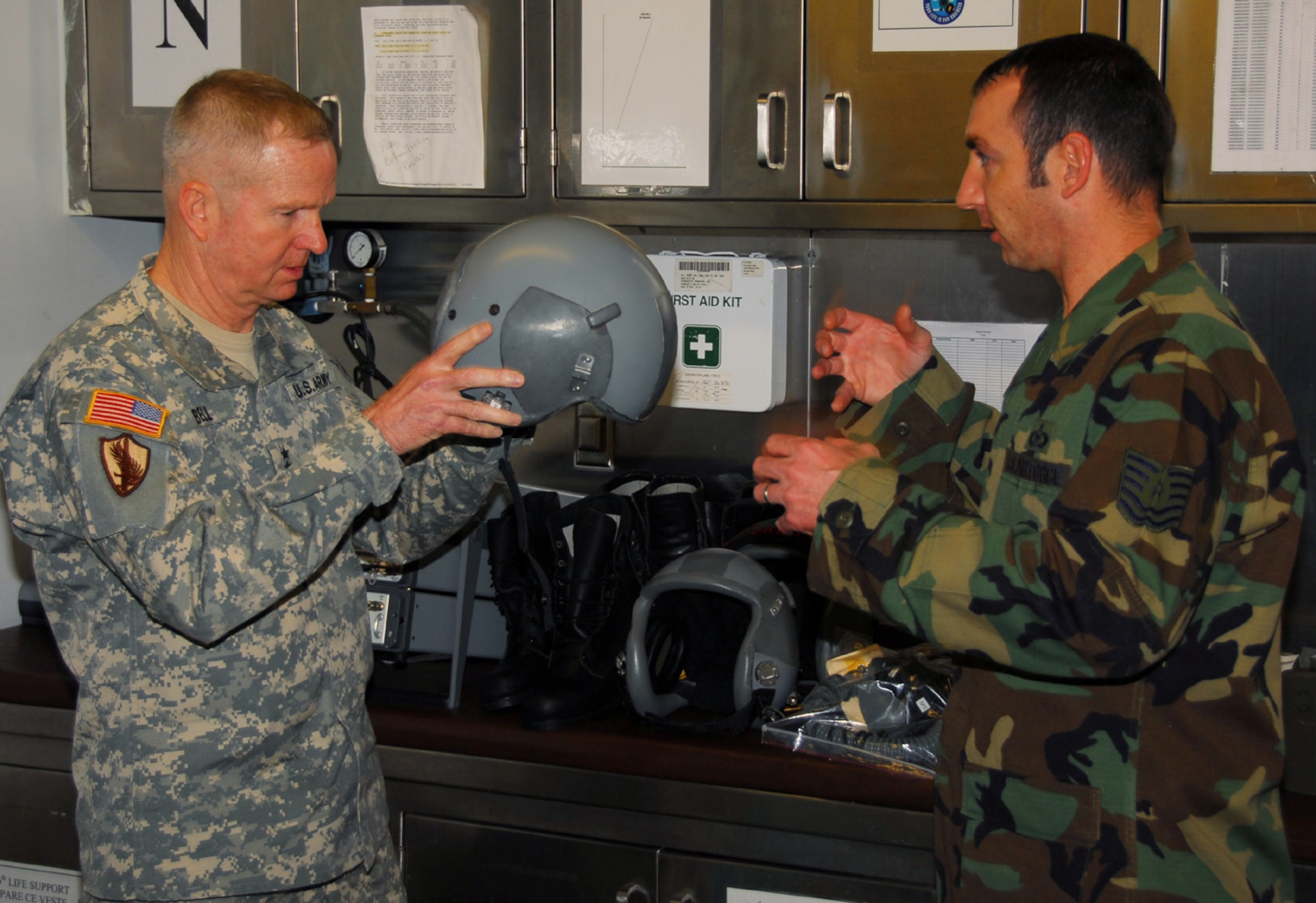 OSAN AIR BASE, Republic of Korea --  Gen. B.B. Bell, commander of U.S. Forces Korea, tries on a helmet  while getting fitted for aircrew flight equipment here Nov. 16. Tech. Sgt. Dustin Ogburn, a 36th Fighter Squadron aircrew flight equipment technician, assisted General Bell through the process in preparation for the general's upcoming flight on a Republic of Korea Air Force F-16. (U.S. Air Force photo by Staff Sgt. Ronnie Hill)