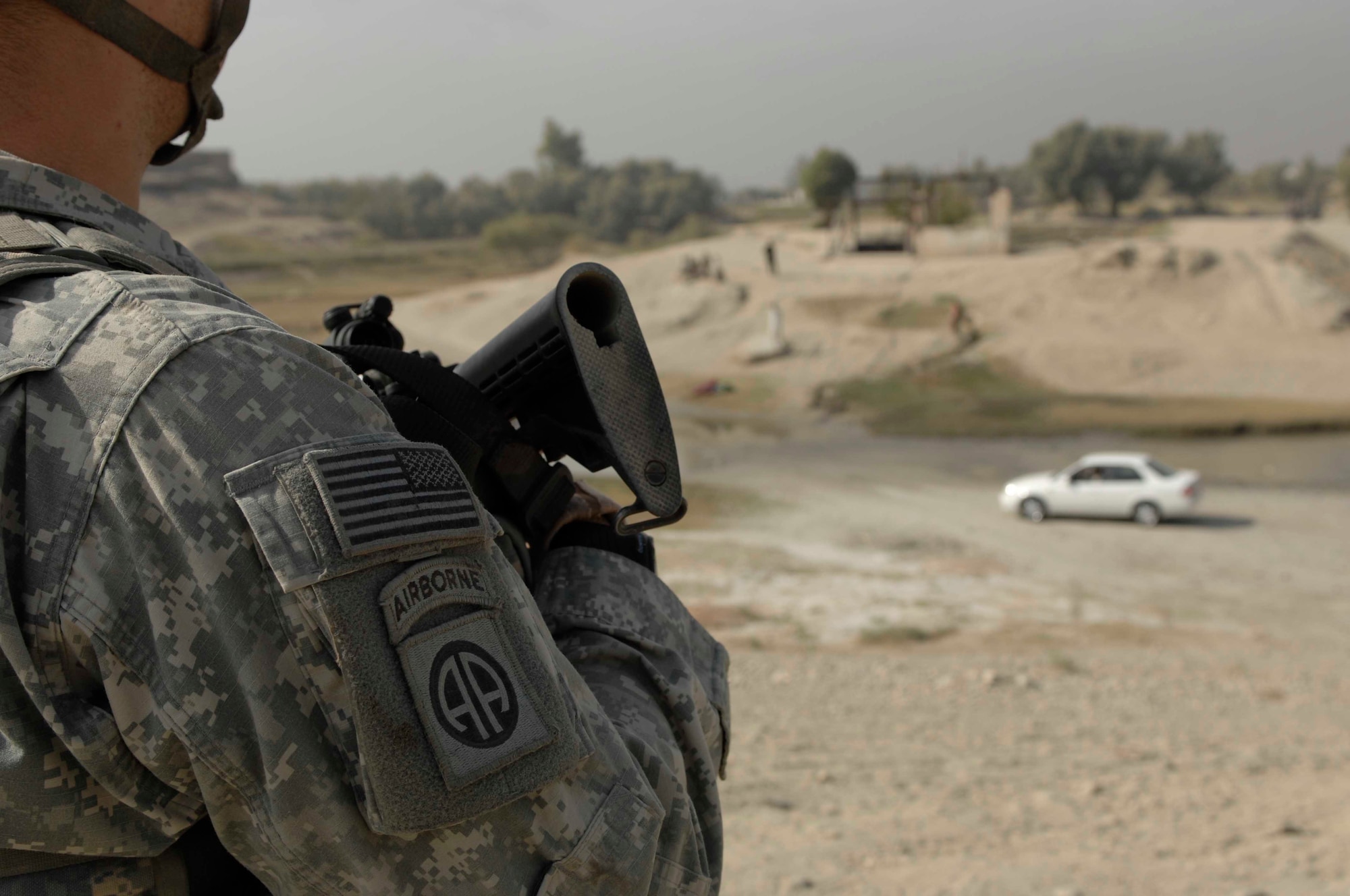 NANGARHAR PROVINCE, Afghanistan - Army Sgt. Zach Slezak provides security while other members of the Nangarhar Provincial Reconstruction Team perform a canal assessment, Nov. 6, 2007.   The Nangarhar PRT is a joint team of Airman, Soldiers, and representatives from the U.S. Department of State, U.S. Agency for International Development, and the U.S. Department of Agriculture.  The team is responsible for helping the Government of the Islamic Republic of Afghanistan improve security, governance and promote reconstruction in Nangarhar Province.  The PRT assesses community needs and then builds schools, government centers, roads, medical capability and basic infrastructure throughout Nangarhar; they also personally mentor Afghan government officials and security forces to provide the Afghan people with the state representation and security they need.
(U.S. Air Force photo / Staff Sgt. Joshua T Jasper)  (Released)
