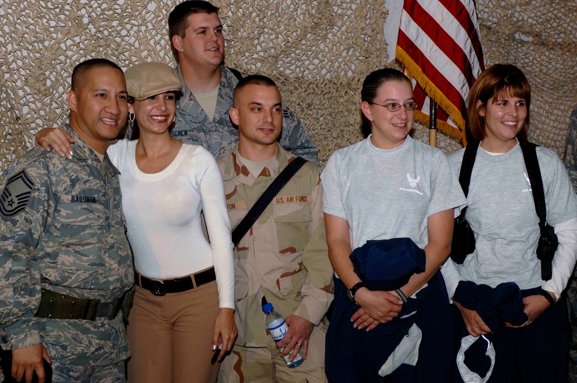 BAGRAM AIR BASE, Afghanistan -  Model Mayra Veronica, best known for being featured in "Maxim" magazine, poses for a group photo with Air Force members from the 455th Air Expeditionary Wing, Nov. 20, 2007.  The USO sponsored a visit by comedian Russell Peters, model Mayra Veronica, and actor Wilmer Valderrama.
(U.S. Air Force photo/Staff Sgt. Joshua T. Jasper)   (Released)
