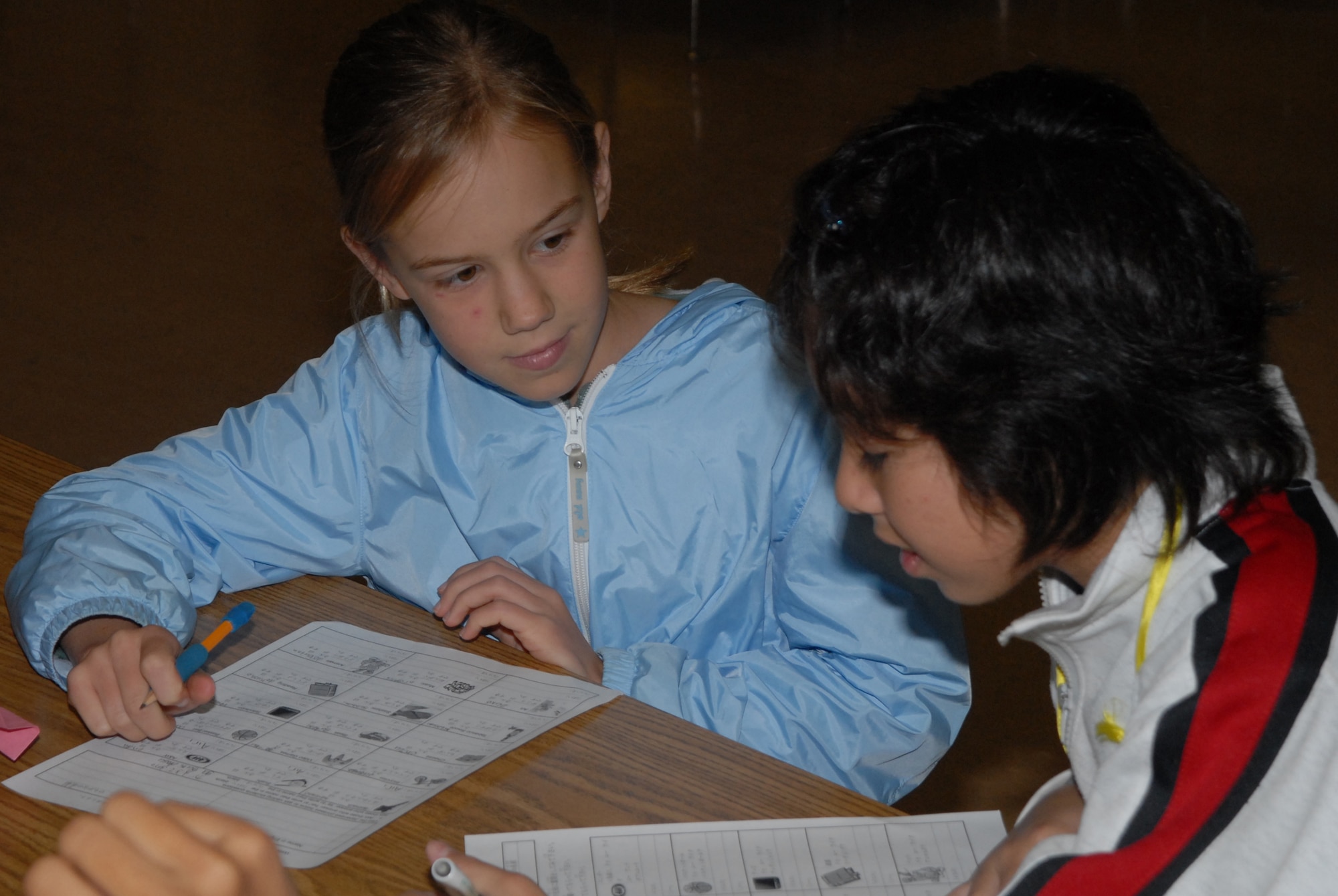 Brenna Gabriel, a Kadena Elementary School fifth-grade student, works on a personality work sheet with Airi Kayoda a local national sixth-grade student during a joint learning experience between American and Japanese children at Kadena Air Base, Japan, Nov. 20, 2007. KES students shared the American custom of Thanksgiving with students from Yara Elementary School. (U.S. Air Force photo/Airman 1st Class Ryan Ivacic) 