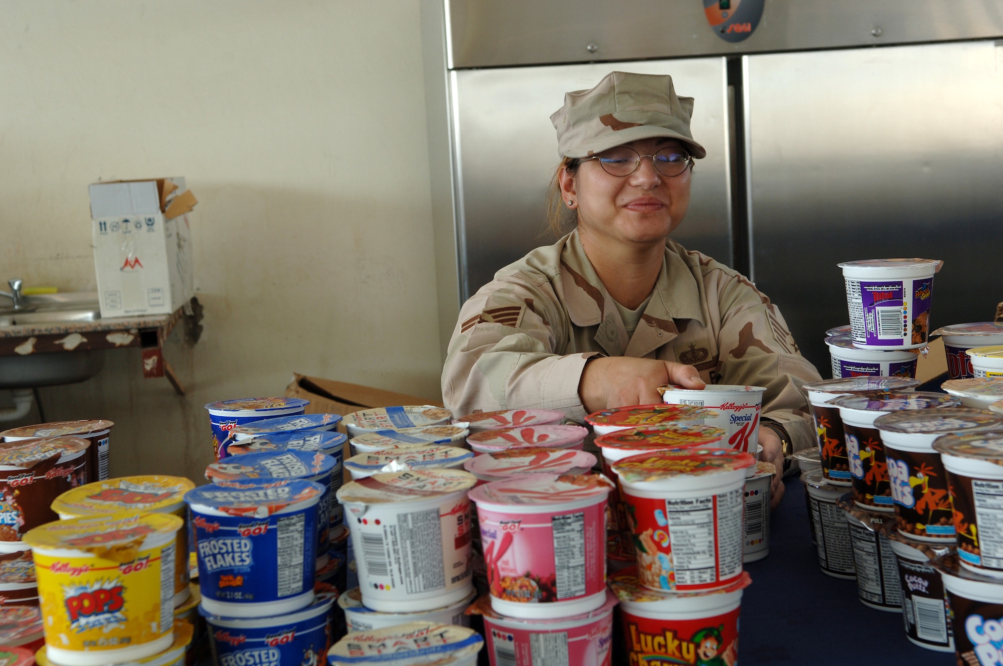 SOUTHWEST ASIA - Service with a smile is second nature to Staff Sgt. Anita Allen, 379th Expeditionary Services Squadron. Sergeant Allen is assisting in the preparations of a Thanksgiving Day breakfast in the Memorial Plaza Nov. 22 at a Southwest Asia air base. Sergeant Allen is deployed from Mountain Home, AFB, Idaho. (U.S. Air Force Photo/Master Sgt. Greg Kunkle)