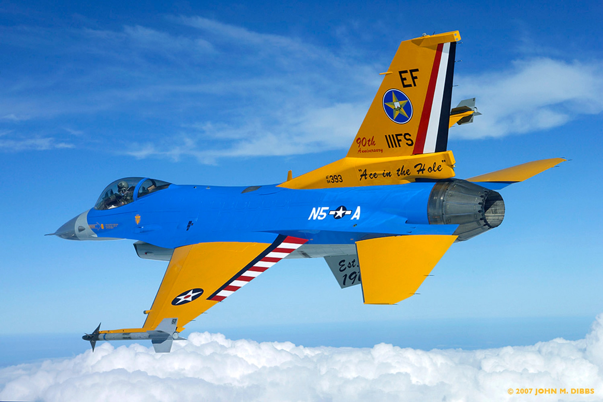 An F-16C Fighting Falcon from the Texas Air National Guard's 111th Fighter Squadron flies with a special paint job in honor of the squadron?s 90th anniversary. All the colors and markings have specific meanings, reflecting the unit?s nine-decade history.  (Photo courtesy of John Dibbs)