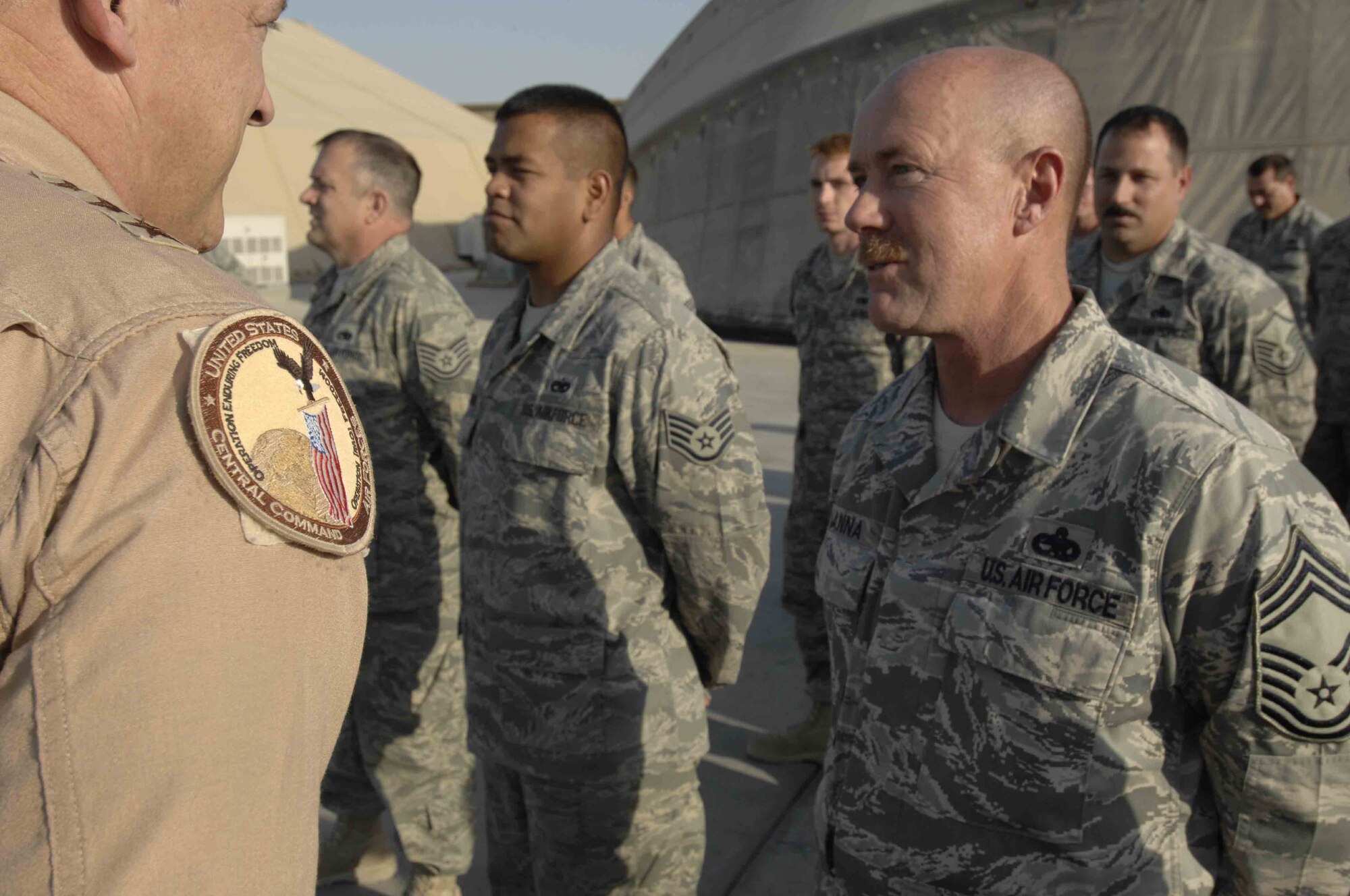 BAGRAM AIR BASE, Afghanistan - Lt. Gen. Gary North, Commander of U.S. Central Command Air Forces, speaks with Chief Master Sgt. Colin Hanna, 455th Expeditionary Aircraft Maintenance Squadron, during a visit here Nov. 22, 2007.  Both General North and CENTAF Command Chief, Chief Master Sgt. Richard Small came here to thank Airmen for their service. (U.S. Air Force Photo by Staff Sgt. Joshua Jasper)