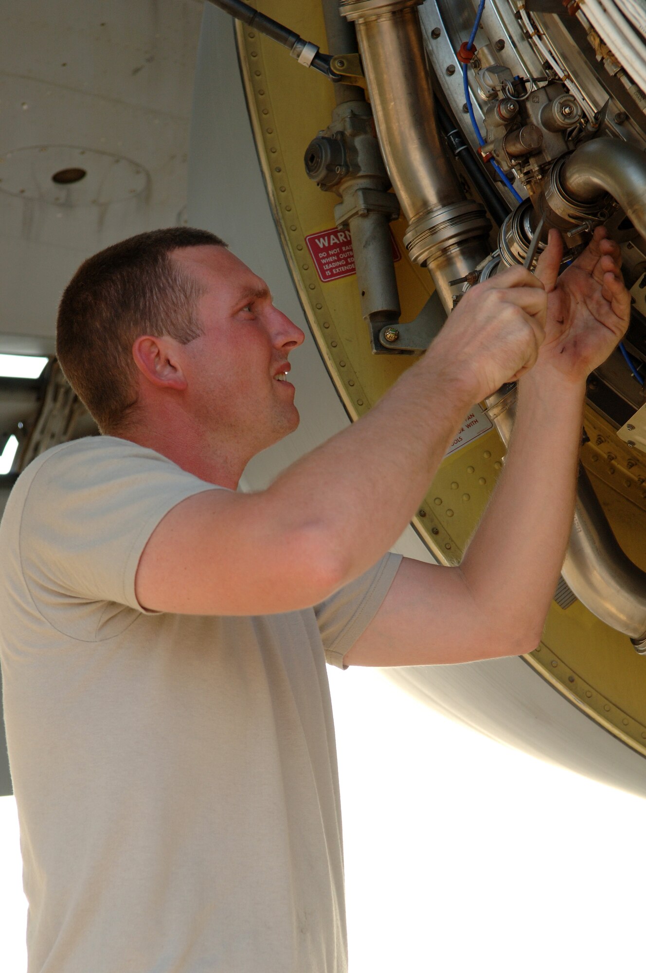 SOUTHWEST ASIA - Staff Sgt. Kyle Harbison, 379th Expeditionary Aircraft Maintenance Squadron, replaces a malfunctioning number one engine anti-icing valve on a KC-135 aircraft Nov. 22 at a Southwest Asia air base. Sergeant Harbison is deployed from Grand Forks AFB, N.D. and his hometown is Quincy, Ill. (U.S. Air Force Photo/Master Sgt. Greg Kunkle)