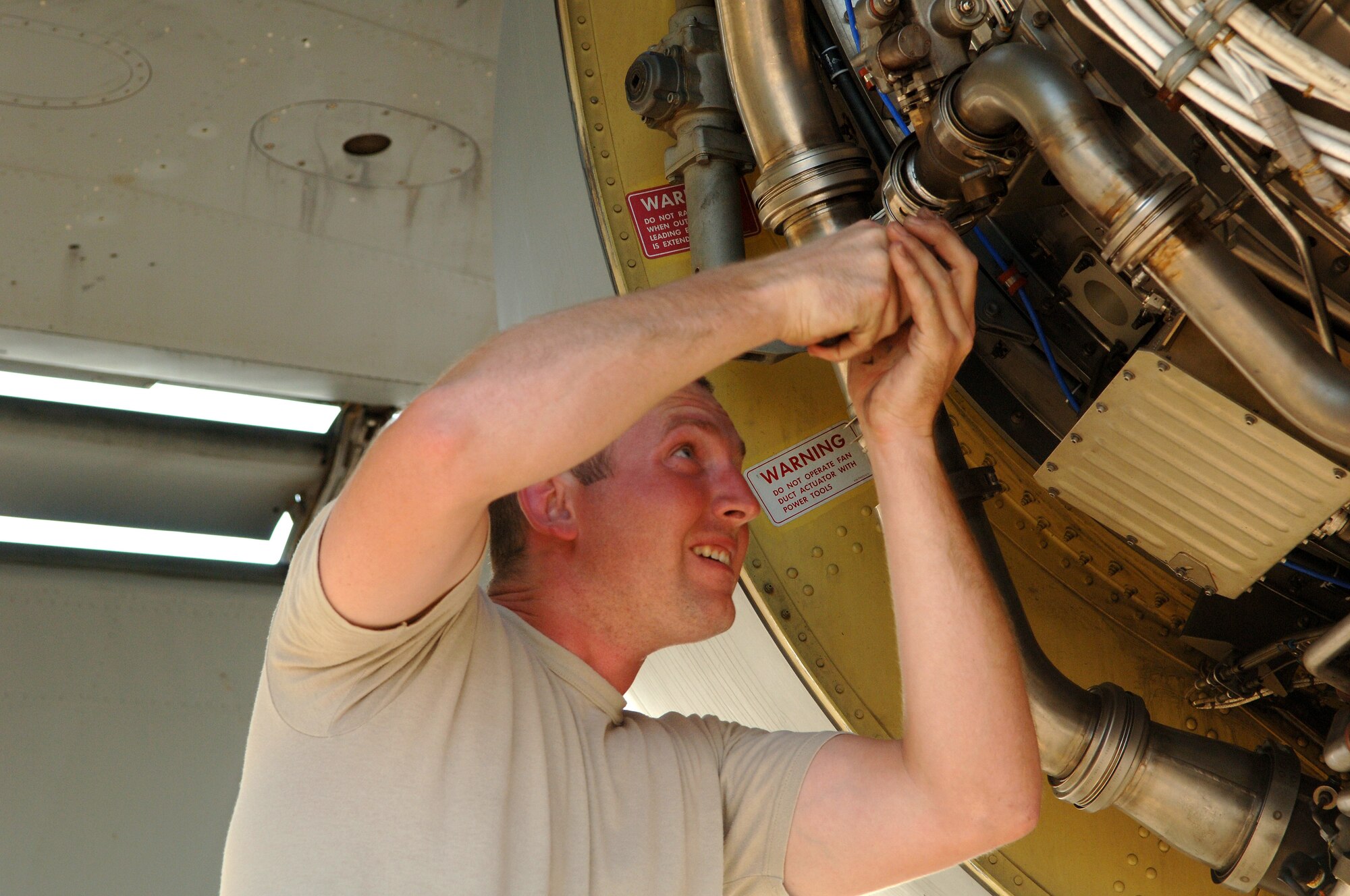 SOUTHWEST ASIA - Staff Sgt. Kyle Harbison, 379th Expeditionary Aircraft Maintenance Squadron, replaces a malfunctioning number one engine anti-icing valve on a KC-135 aircraft Nov. 22 at a Southwest Asia air base. Sergeant Harbison is deployed from Grand Forks AFB, N.D. and his hometown is Quincy, Ill. (U.S. Air Force Photo/Master Sgt. Greg Kunkle)