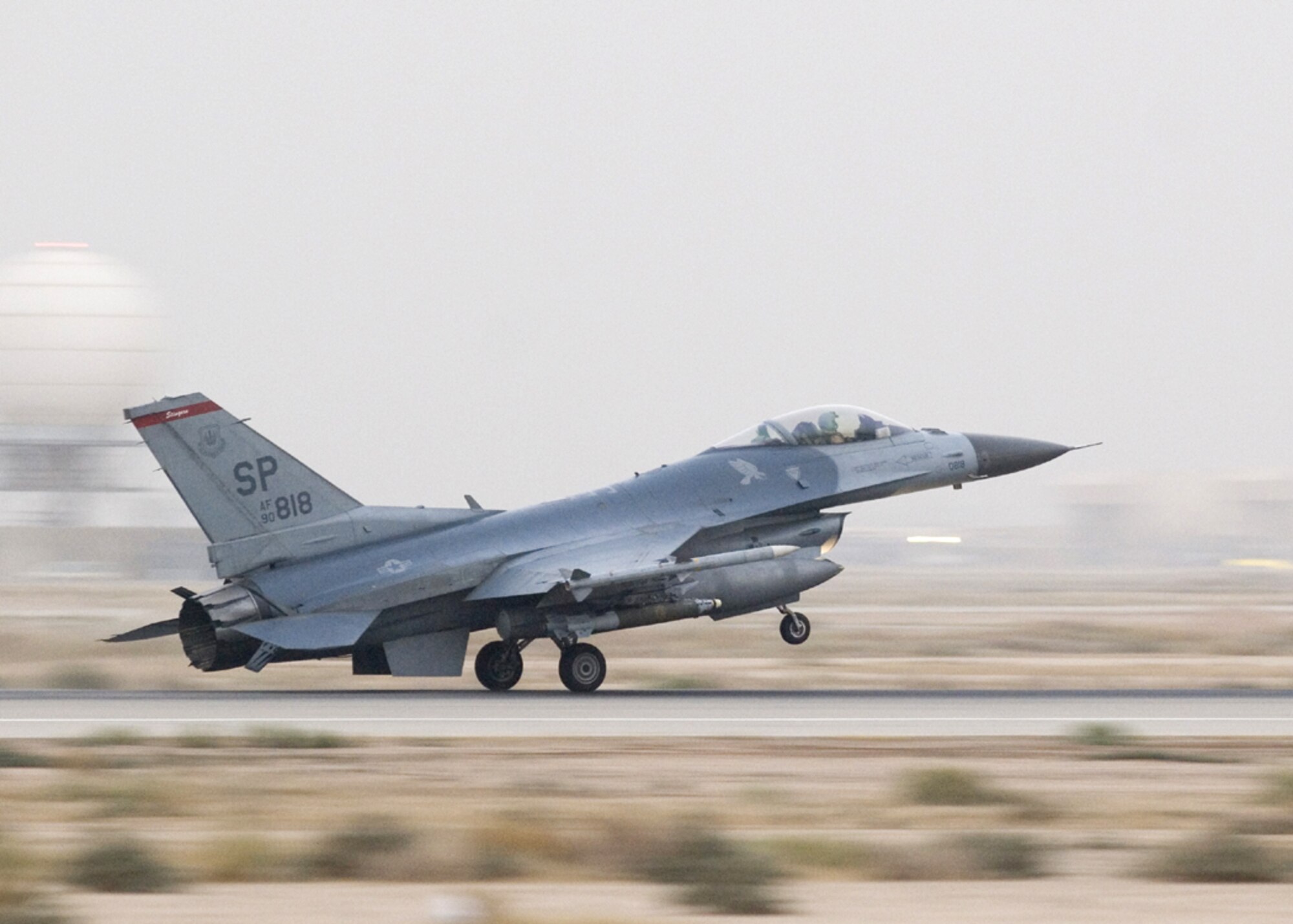 IRAQ - An F-16 Fighting Falcon from the 22nd Expeditionary Fighter Squadron lands at Balad Air Base, Iraq, after conducting a mission in support of Operation Iraqi Freedom.  The F-16s and aircrews currently assigned to the 22nd EFS are deployed from Spangdahlem Air Base, Germany.  (U.S. Air Force photo/Master Sgt. John Nimmo, Sr.)