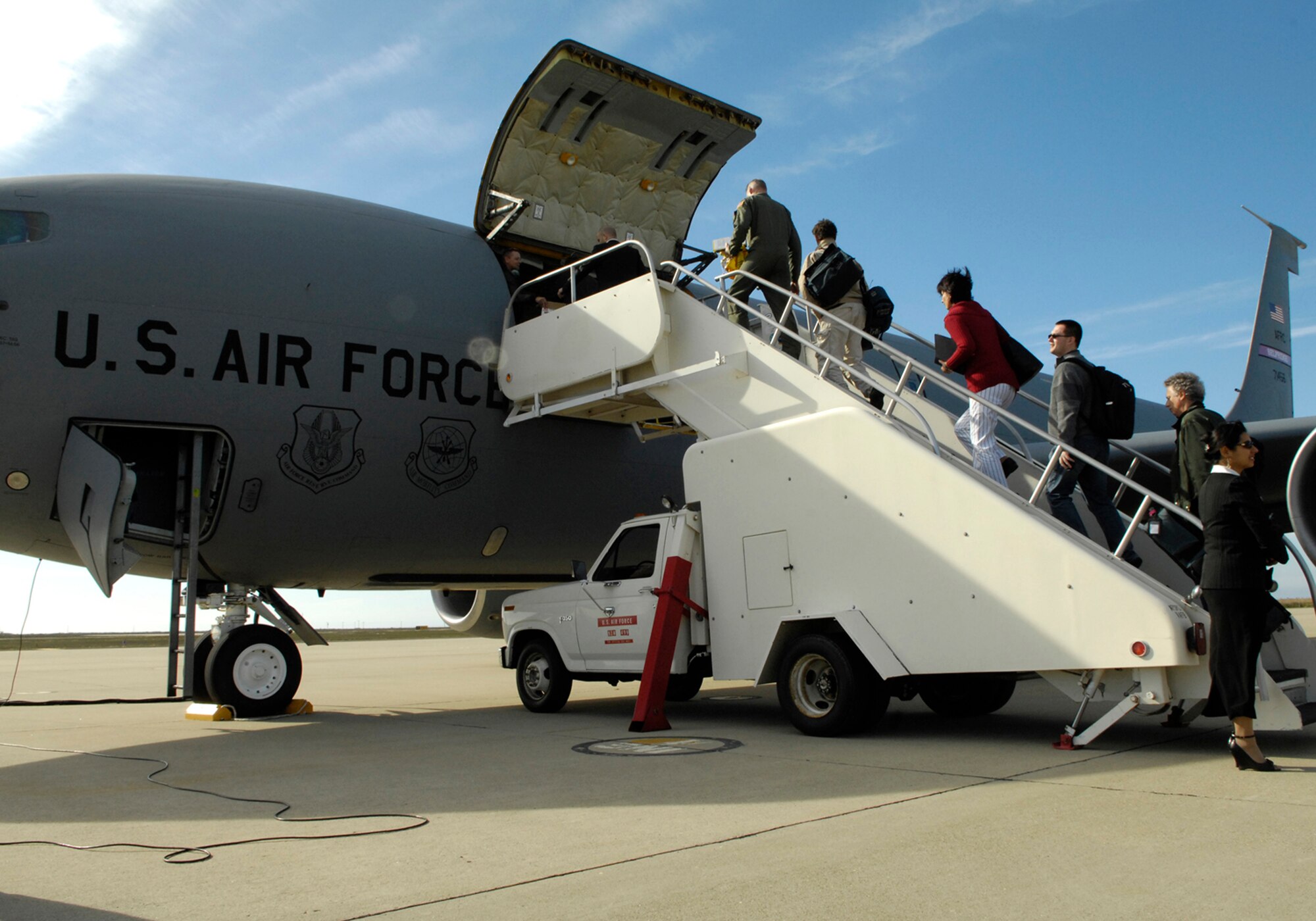 VANDENBERG AIR FORCE BASE, Calif. -- NATO delegates board an Air Force KC-135 on their way to Beale Air Force Base, Calif., after finishing a tour of Vandenberg and learning about missile defense on Nov. 19.  (U.S. Air Force photo/Airman 1st Class Cole Presley)
