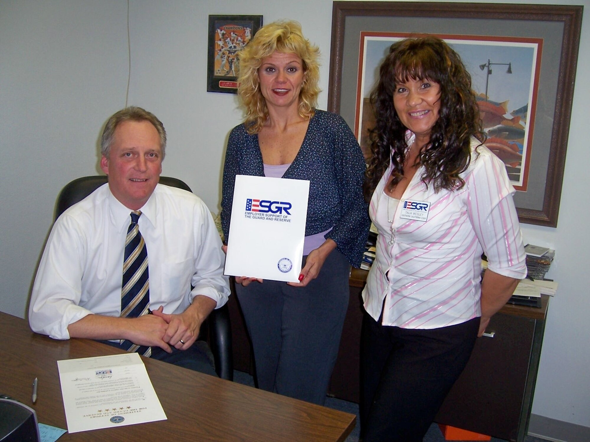 Bob Westergard, March Air Reserve Base BX manager, Stephanie Kuykendall, March Base Exchange, and Talia Wesley, program support specialist for Southern California ESGR, Employer Support for the Guard and Reserve which is a Department of Defense organization, sign a statement of support publicly demonstrating support for their employees who serve in the National Guard and Reserve. The ESGR 5-Star Employer Program seeks to inform and educate employers about their rights and responsibilities towards their employees who serve in the National Guard and Reserve, and to also recognize and reward those employers who go “over and above” the requirements of the law.

A 5-Star Employer denotes the following:
1. Signed a Statement of Support publicly demonstrating support for their employees who serve in the National Guard and Reserve. 
2. Reviewed their human resources policies to ensure compliance with the Uniformed Services Employment and Re-Employment Rights Act Law (USERRA). 
3. Promotes training for managers and supervisors to effectively manage their employees who serve in the Guard and Reserve. 
4. Adopted polices and programs that are “Above and Beyond” what is required by the USERRA Law. 
5. Serves as an advocate for employee service in the National Guard and Reserve and helps to promote the mission of ESGR.  (U.S. Air Force photo)