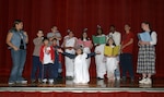 Cast members of "The Best Christmas Pageant Ever" practice Nov. 14 in anticipation of their Dec. 14 opening night. The Christmas comedy is produced by the Lackland Performing Arts Group. Show dates are Dec. 14 and 15 at 7 p.m., Dec. 16 at 2 p.m., and Dec. 21 and 22 at 7 p.m. at the Bob Hope Performing Arts Theater. Doors open one hour prior to the show. Tickets are $3 for adults and $2 for senior citizens and children 13 and younger. (USAF photo by Alan Boedeker)                              