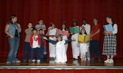Cast members of "The Best Christmas Pageant Ever" practice Nov. 14 in anticipation of their Dec. 14 opening night. The Christmas comedy is produced by the Lackland Performing Arts Group. Show dates are Dec. 14 and 15 at 7 p.m., Dec. 16 at 2 p.m., and Dec. 21 and 22 at 7 p.m. at the Bob Hope Performing Arts Theater. Doors open one hour prior to the show. Tickets are $3 for adults and $2 for senior citizens and children 13 and younger. (USAF photo by Alan Boedeker)                              