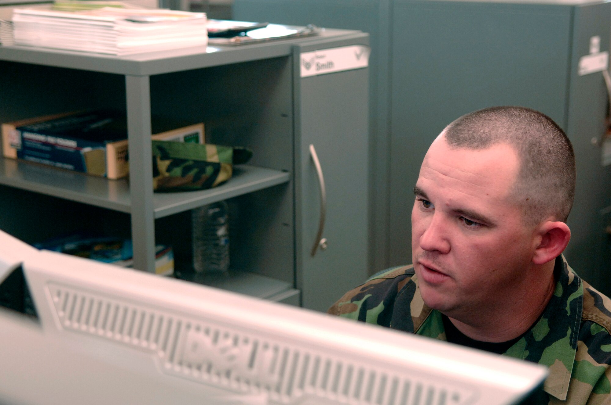 U.S. Air Force Senior Airman Robert Smith, from the Air Force Financial Service Center (AFFSC), reviews financial documents at Ellsworth Air Force Base, S.D., Nov. 21, 2007.  Smith processes pay and entitlements in the Air Combat Command Military Pay section of the AFFSC.  (U.S. Air Force photo by Staff Sgt. Michael B. Keller)(Released)