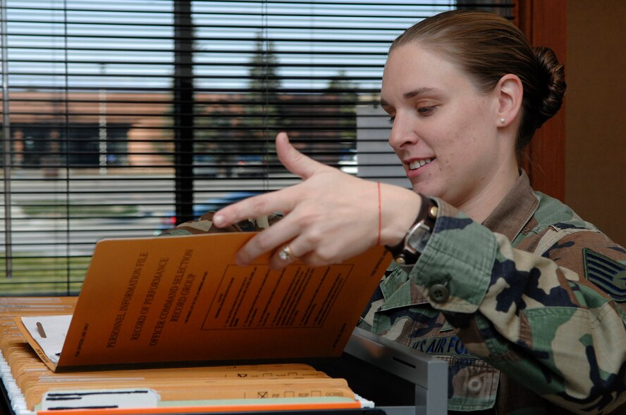 U.S. Air Force Tech. Sgt. Sharla Riley from the Air Force Financial Service Center, files away personnel paperwork Nov. 21. Sergeant Riley deals with a multitude of issues as the NCO in Charge of the AFFSC commander's support staff. (U.S. Air Force photo by Staff Sgt. Michael B. Keller) 
