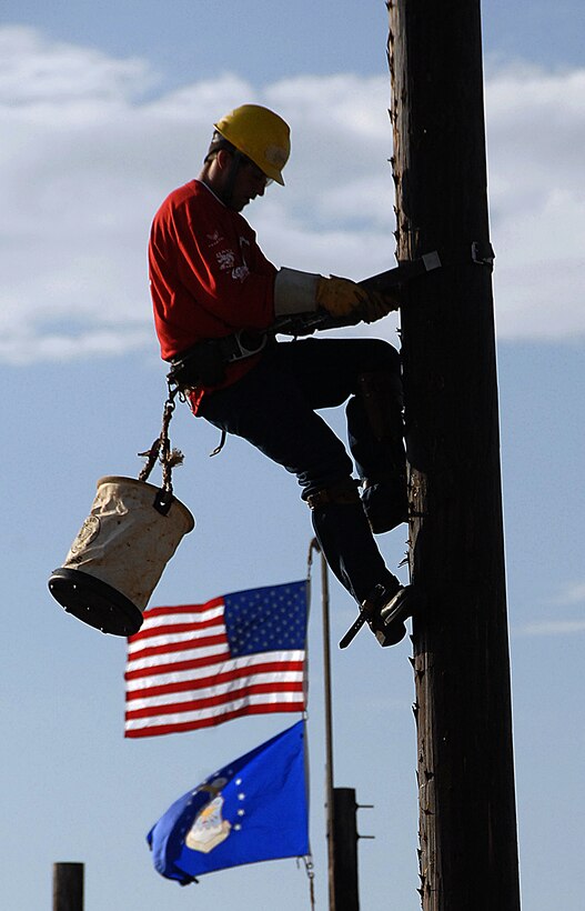 A competitor climbs down a pole Nov. 17 at the semi-annual Student Lineman's Rodeo at the 366th Training Squadron. Students in the electrical systems course compete in five events during the one-day event. (U.S. Air Force photo/Harry Tonemah)