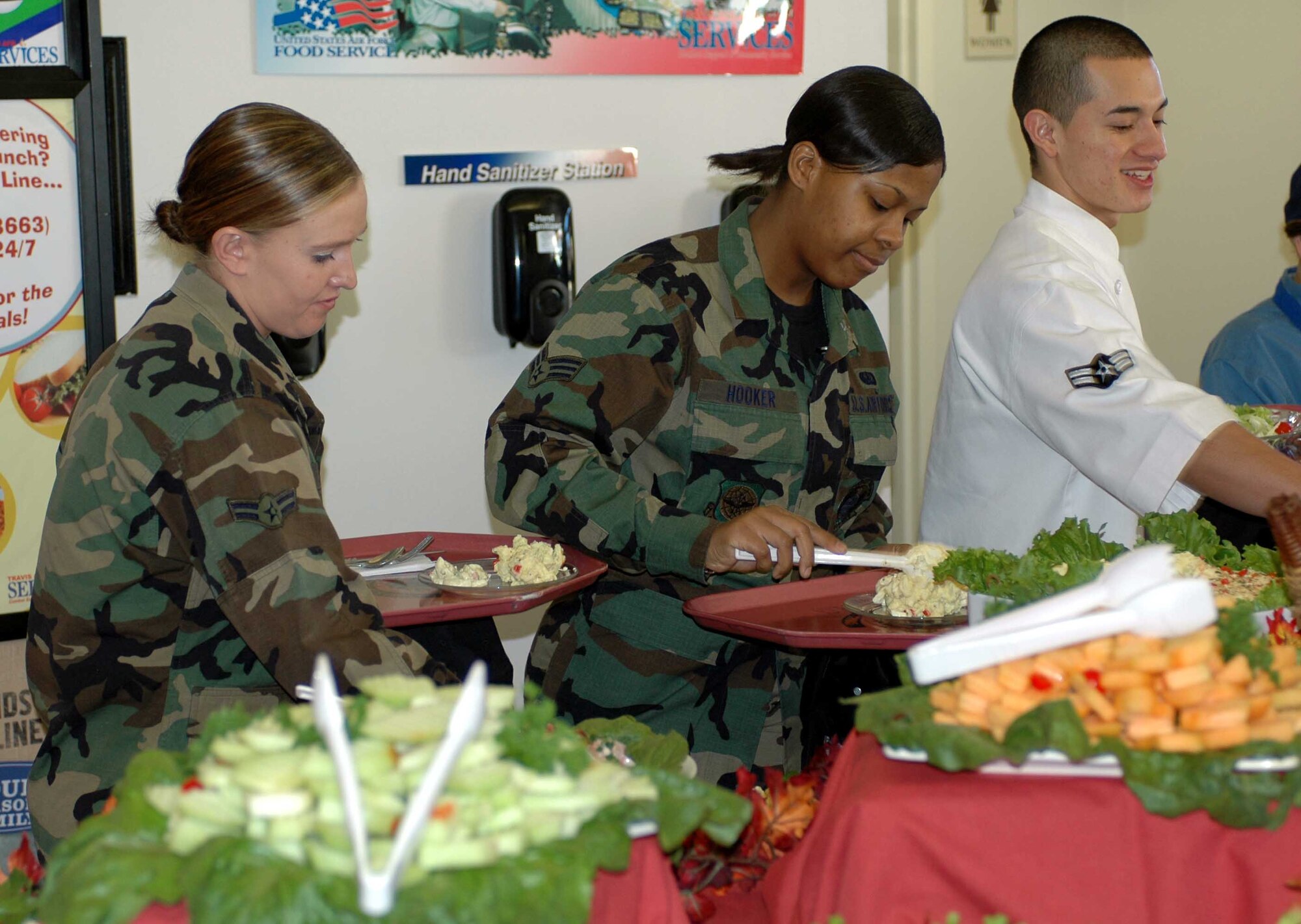 Team Travis Airmen enjoy a Thanksgiving Day meal at the Sierra Inn Dining Facility. Airmen, Retirees and family members were served a festive meal by Team Travis leadership. (U.S. Air Force photo/Senior Airman Shaun Emery)